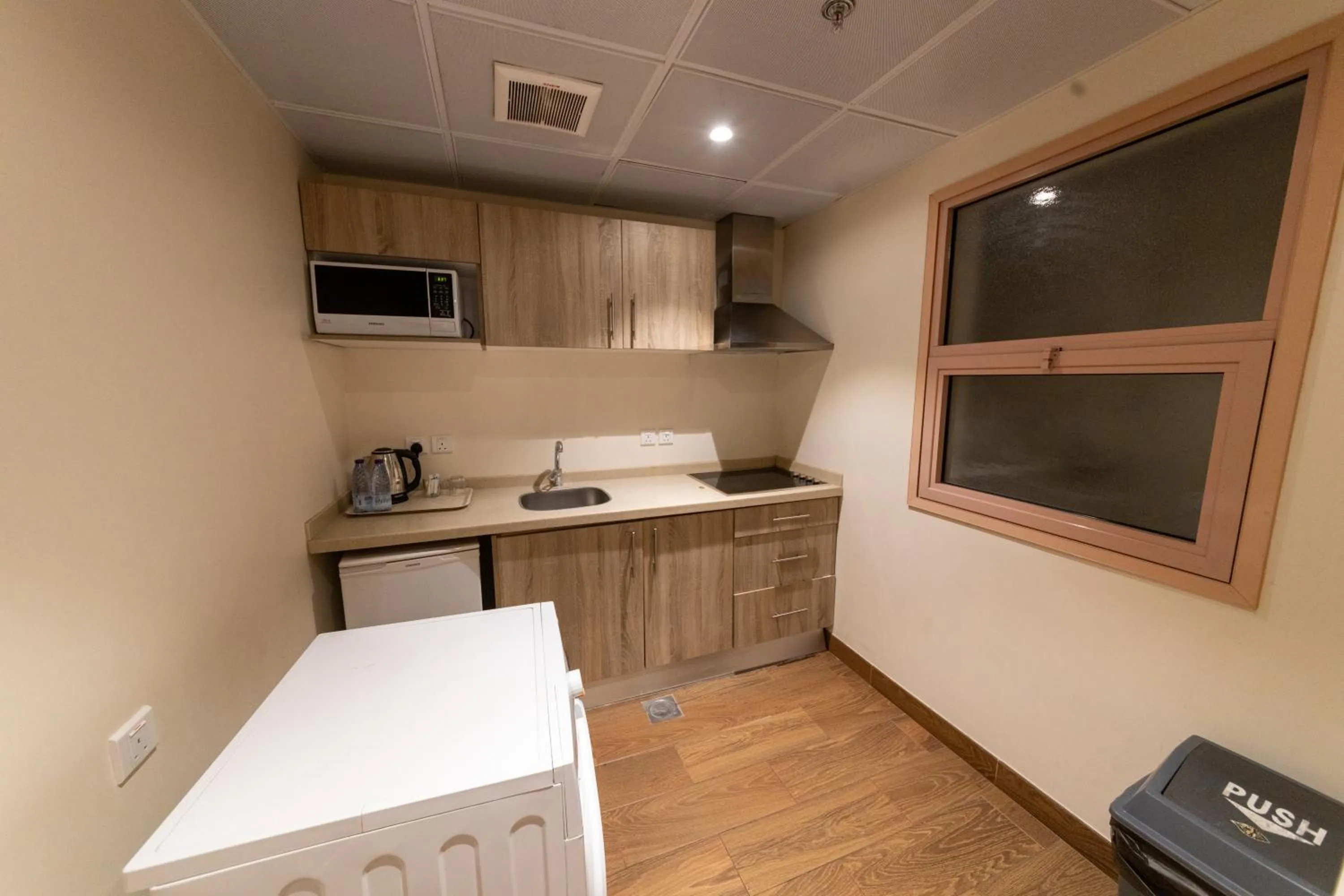 Kitchen or kitchenette in Burj Al Hayat Hotel Suites - Al Olaya