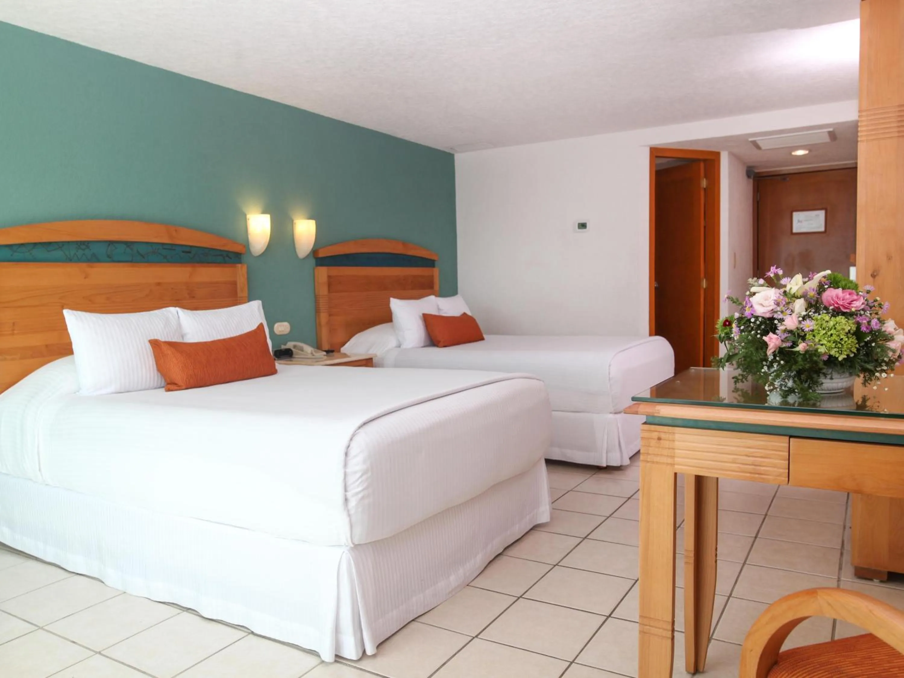 Bed in Hotel Casa Mexicana Cozumel