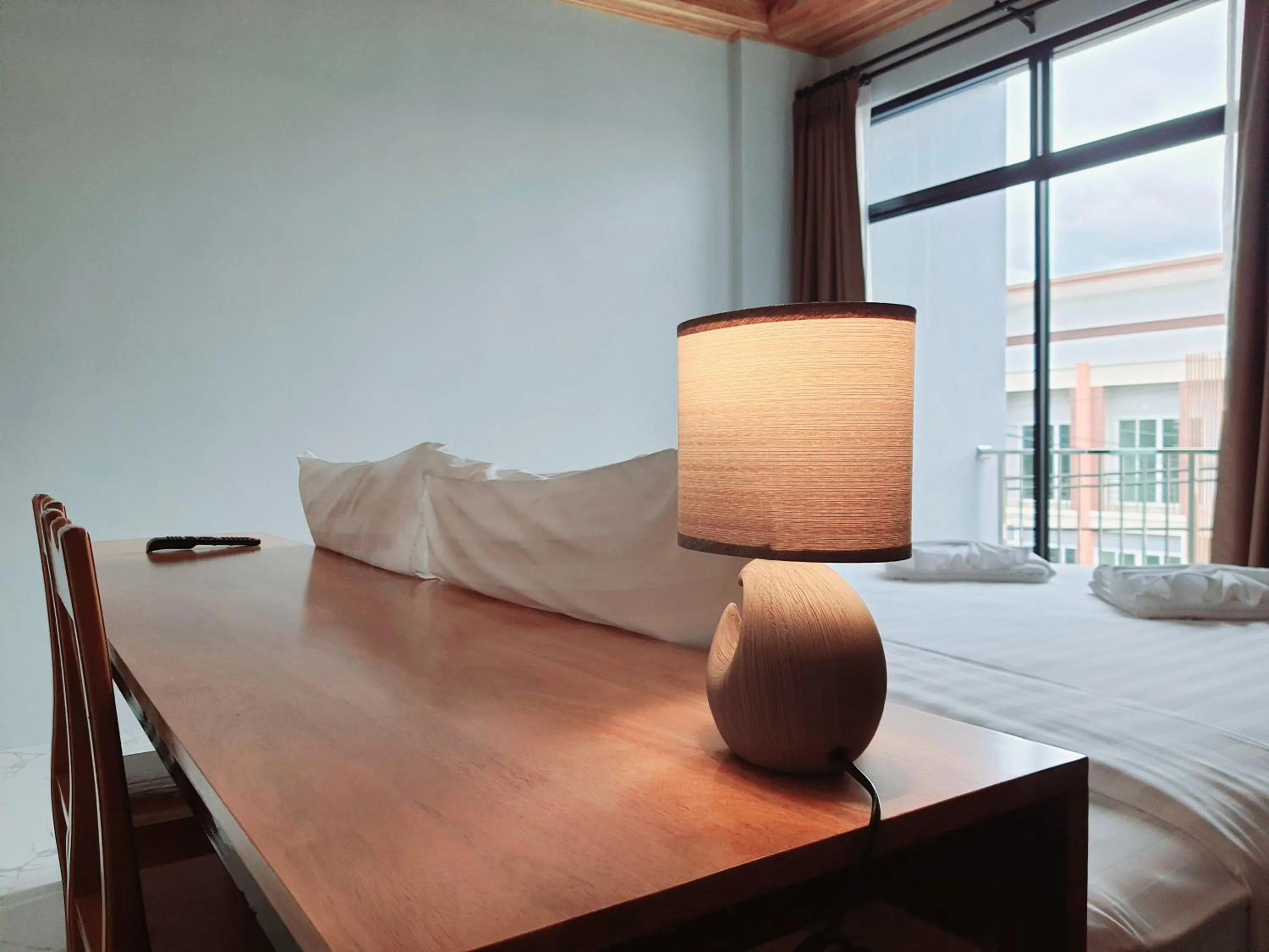 Seating area, Bed in SUhotel Suratthani