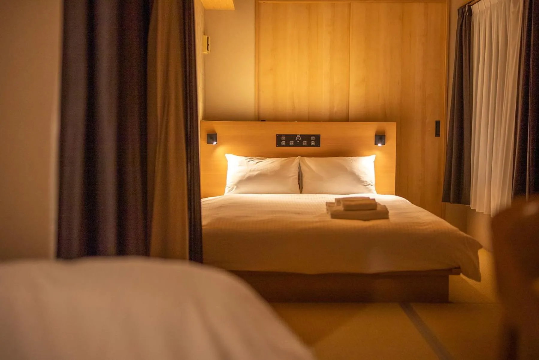 Bed in WELLSTAY Shinsekai Wakyo