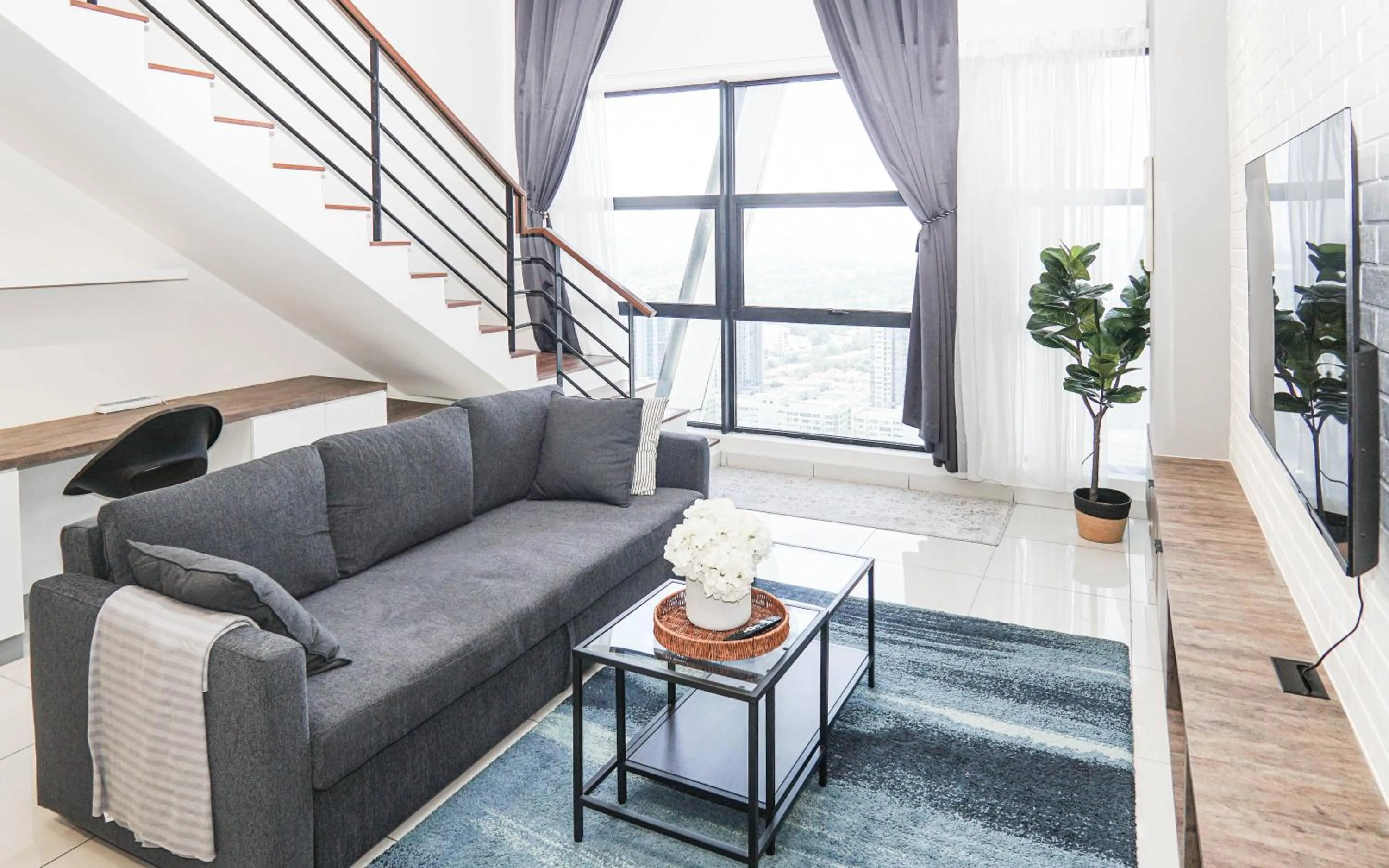 Living room in Arte Mont Kiara by Airhost