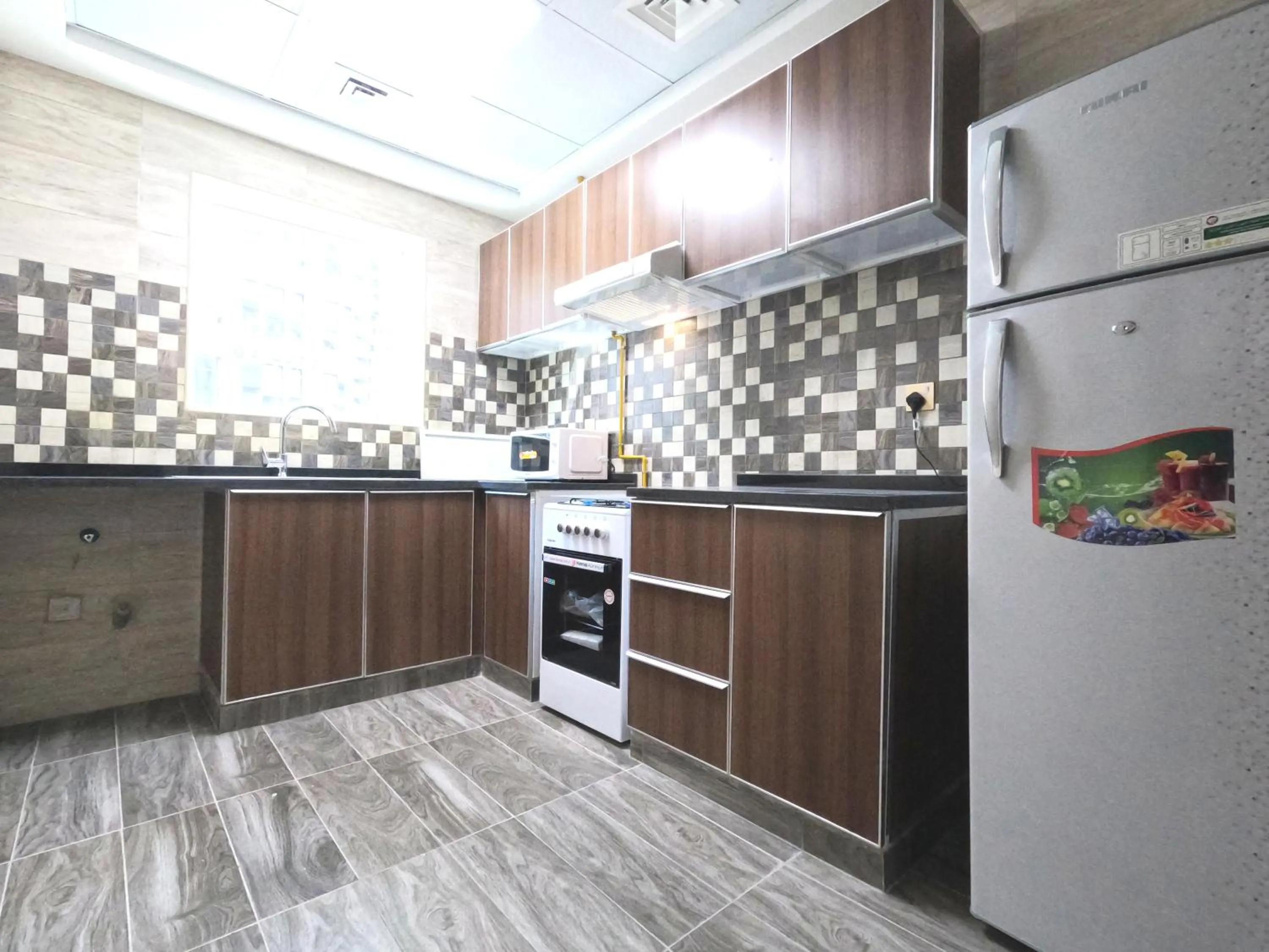 Communal kitchen in Barsha Star Residence - Home Stay