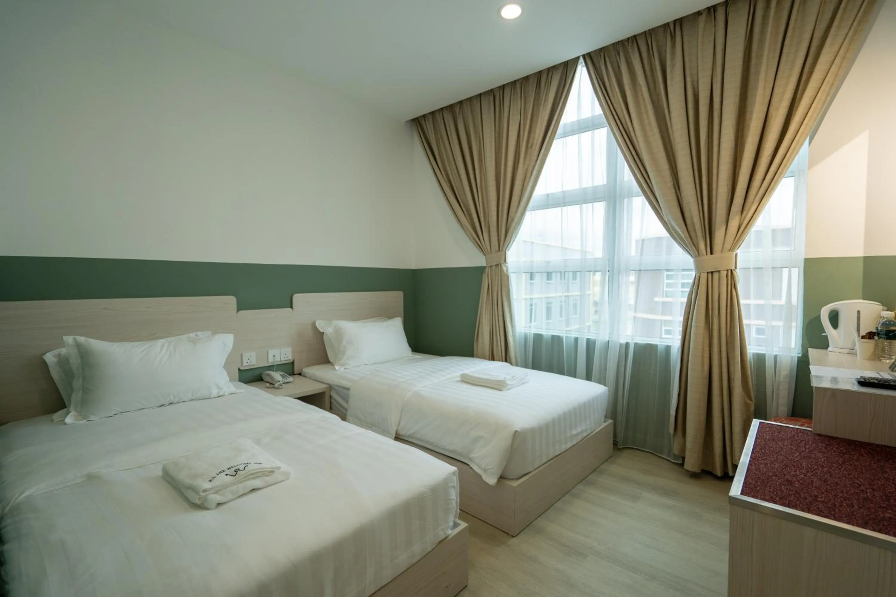 Bed in All Are Welcome Lawas Boutique Hotel