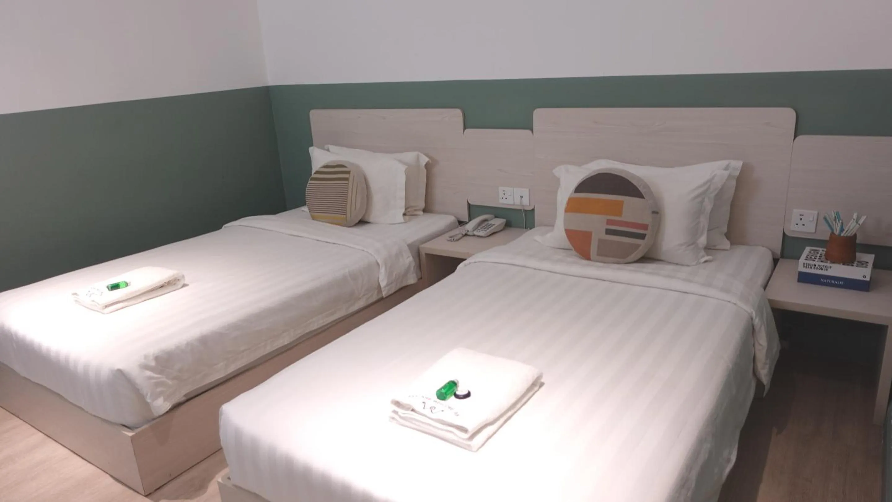 Bed in All Are Welcome Lawas Boutique Hotel