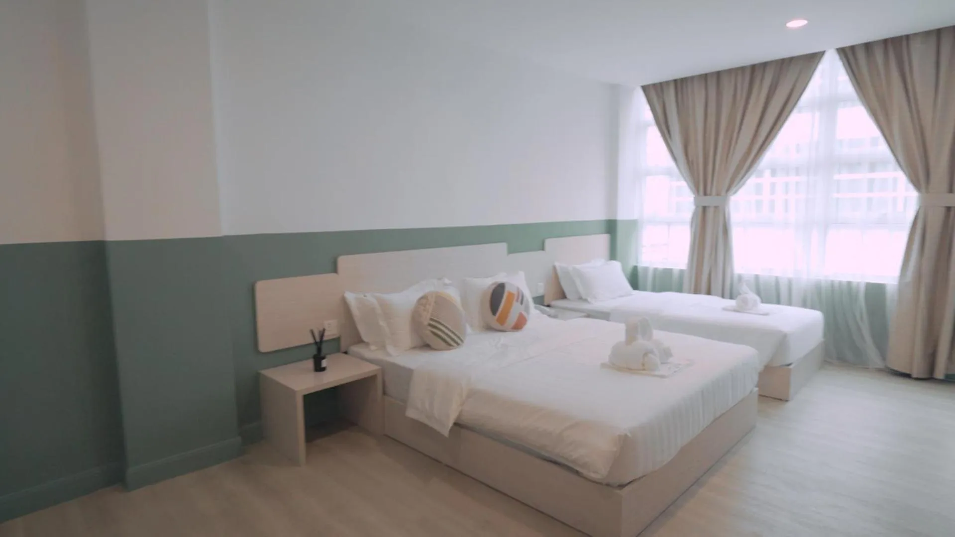 Bed in All Are Welcome Lawas Boutique Hotel