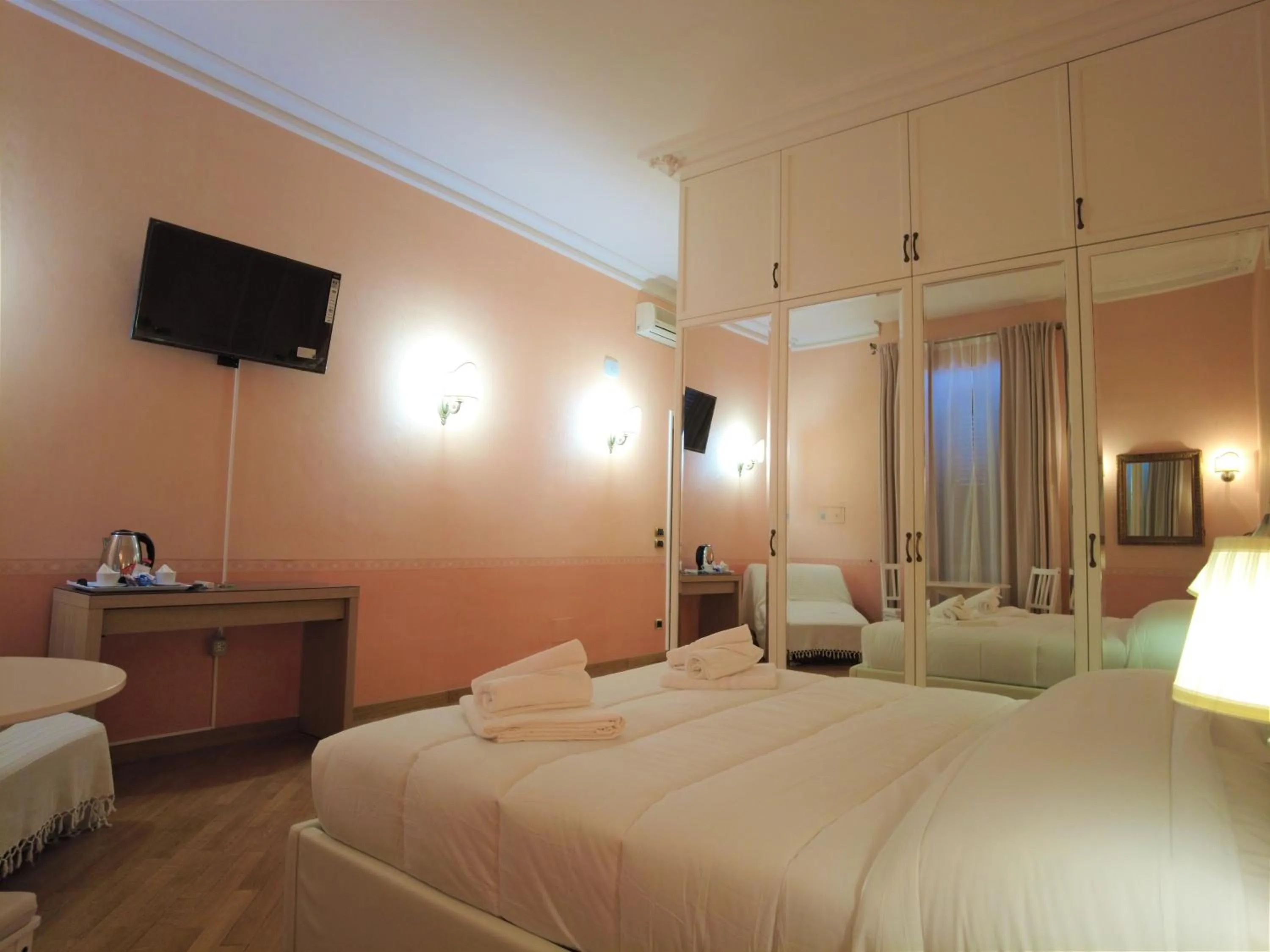 Bed in Gardoce's Guest House