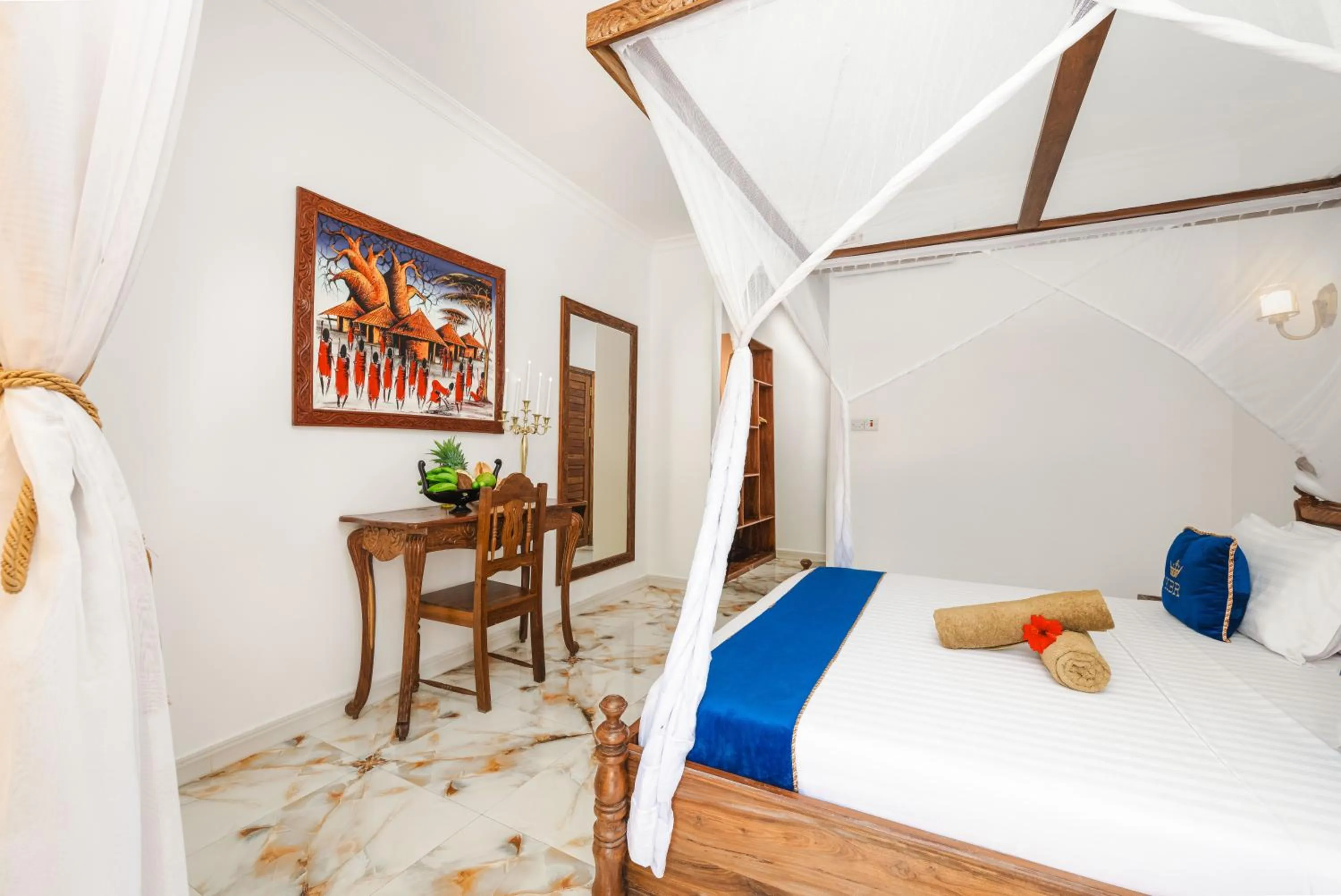 Bed in Karibu Beach Resort