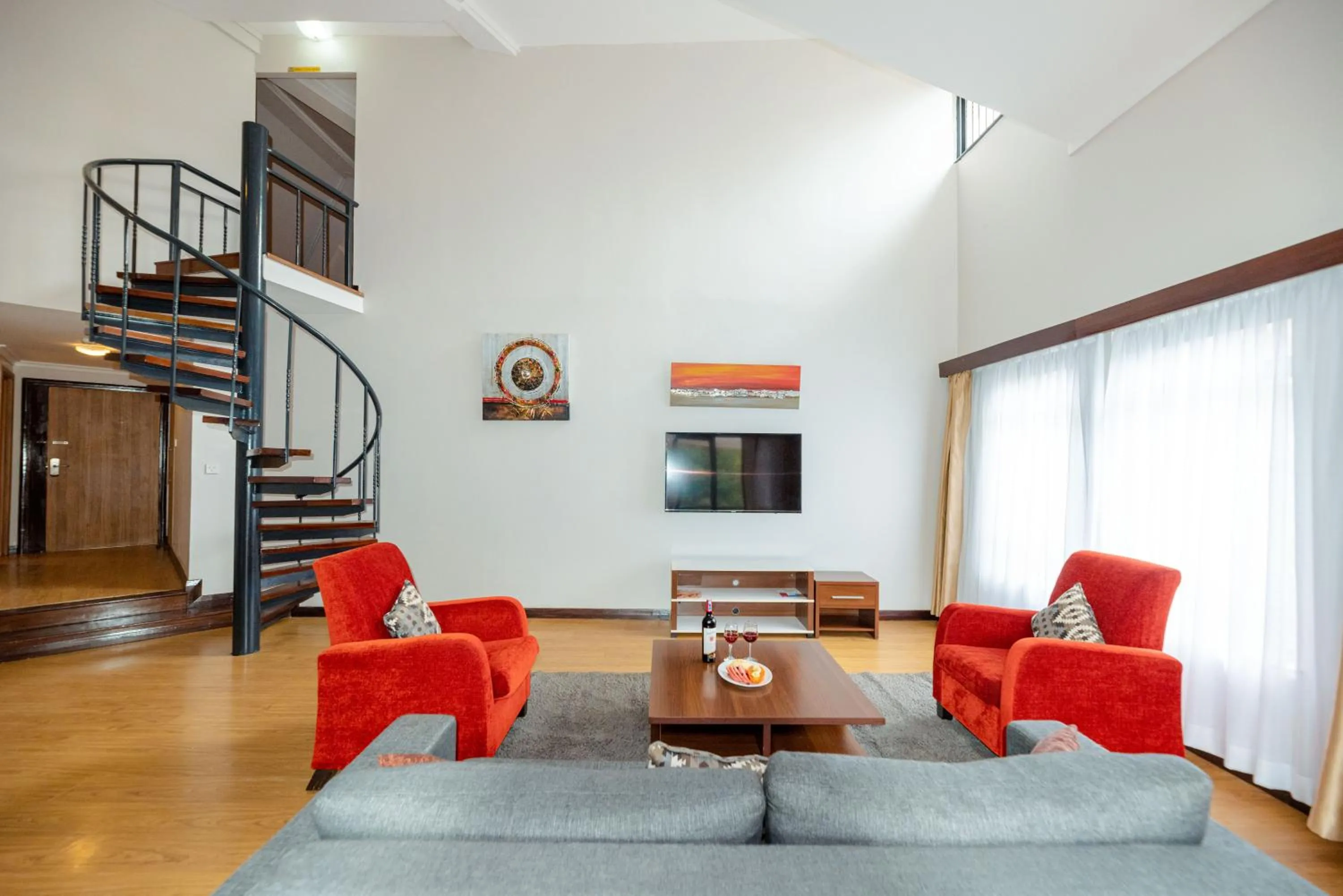 Living room in Heri Heights Hotel Apartments, SureStay Collection by Best Western