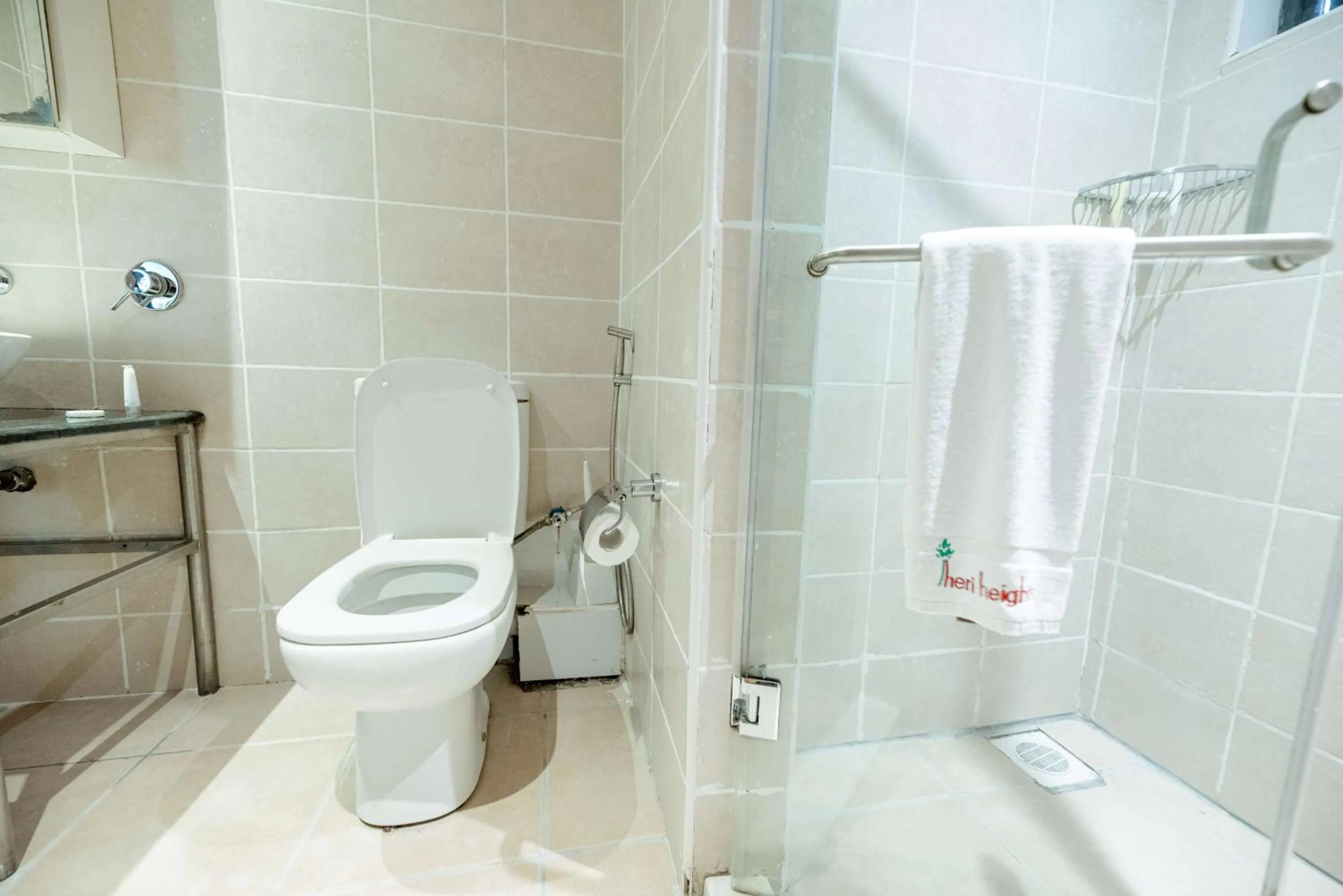 Bathroom in Heri Heights Hotel Apartments, SureStay Collection by Best Western