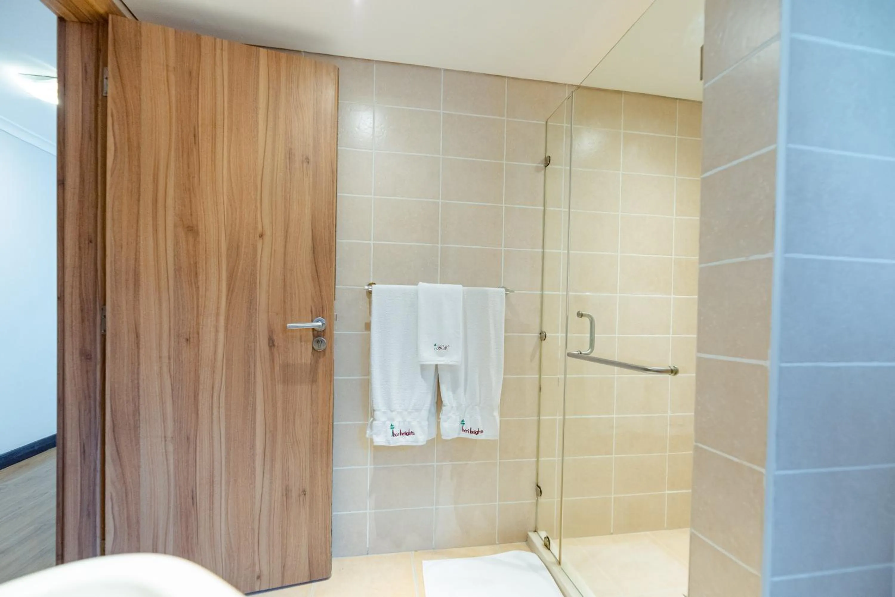Shower in Heri Heights Hotel Apartments, SureStay Collection by Best Western