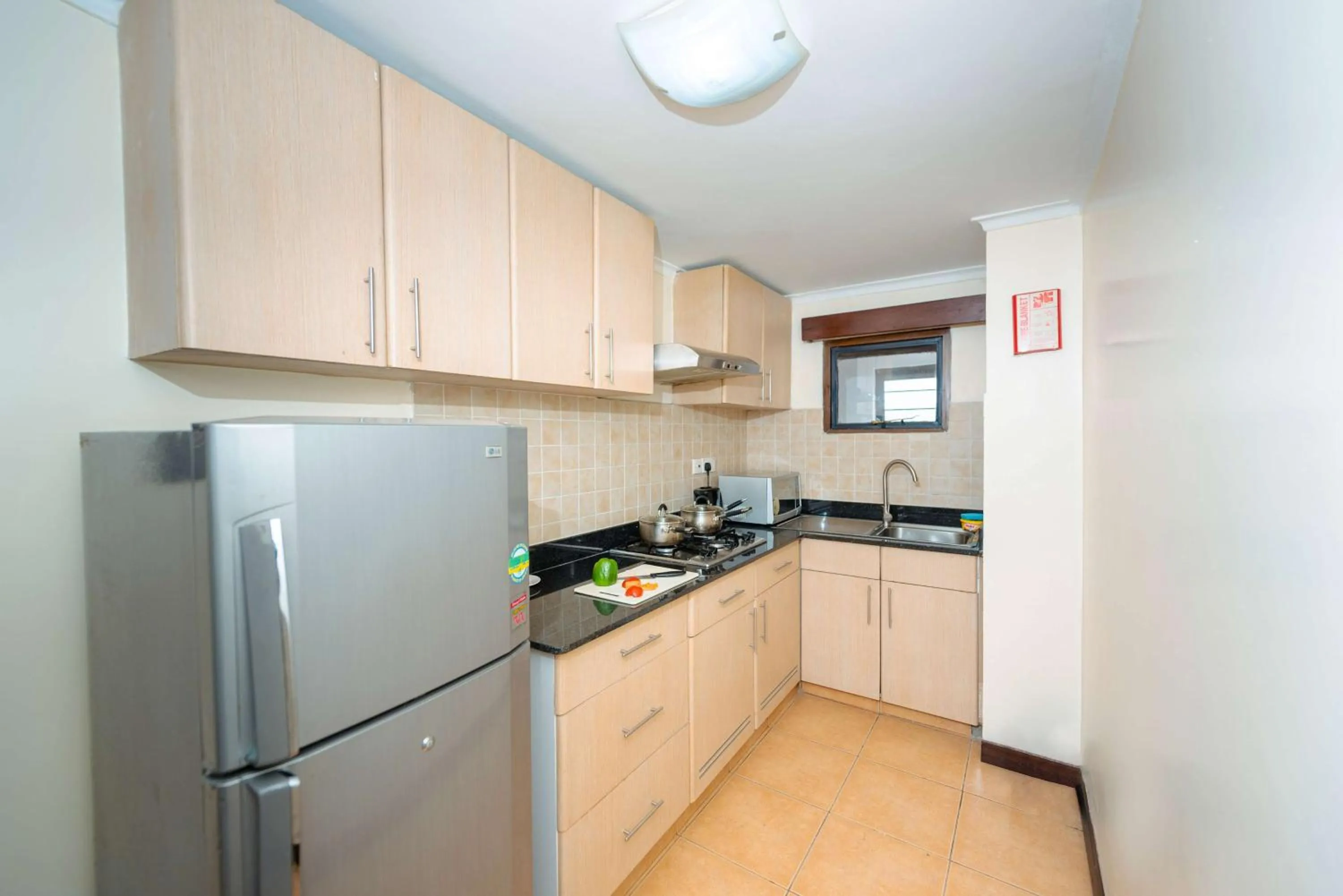 Kitchen or kitchenette in Heri Heights Hotel Apartments, SureStay Collection by Best Western