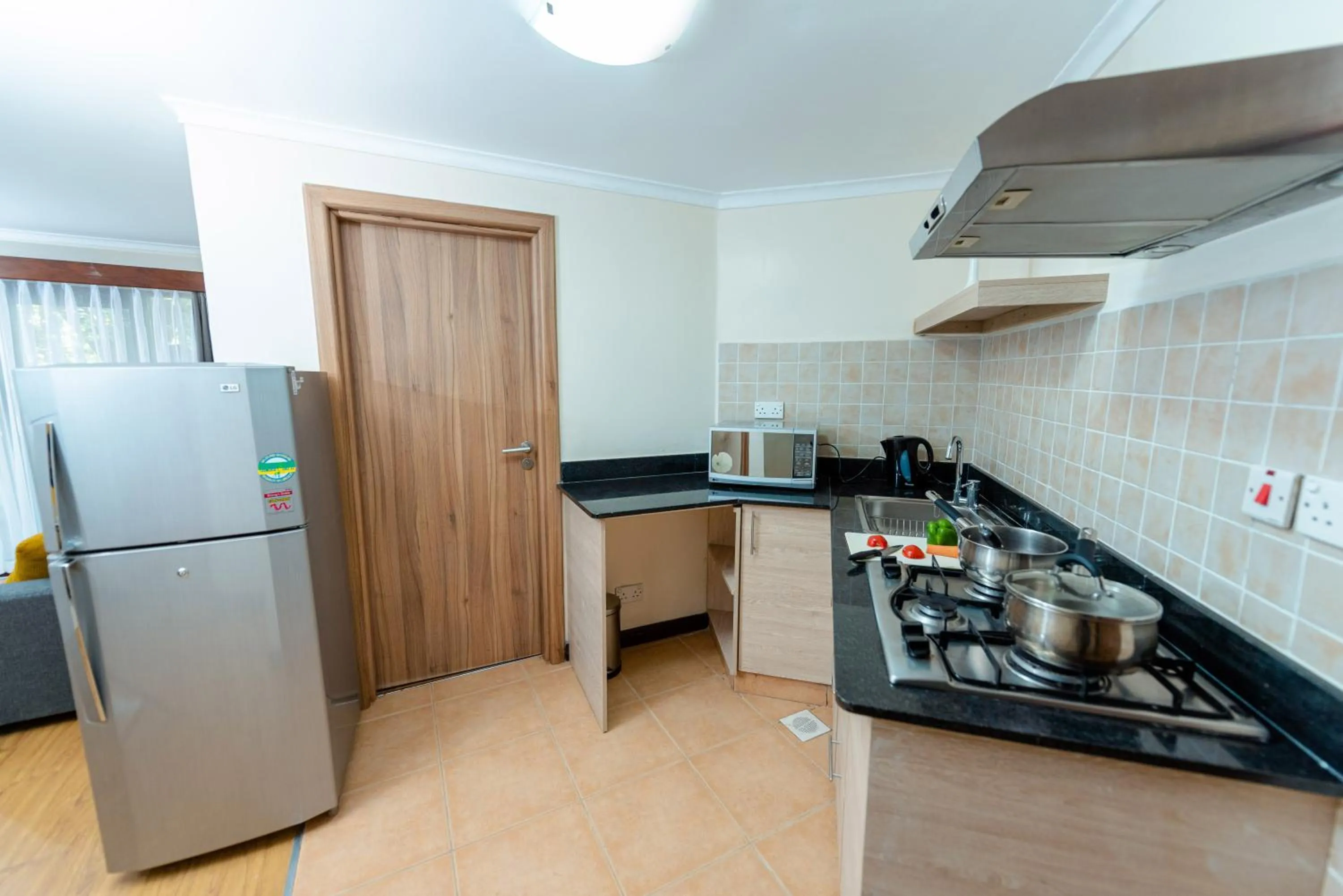 Kitchen or kitchenette in Heri Heights Hotel Apartments, SureStay Collection by Best Western