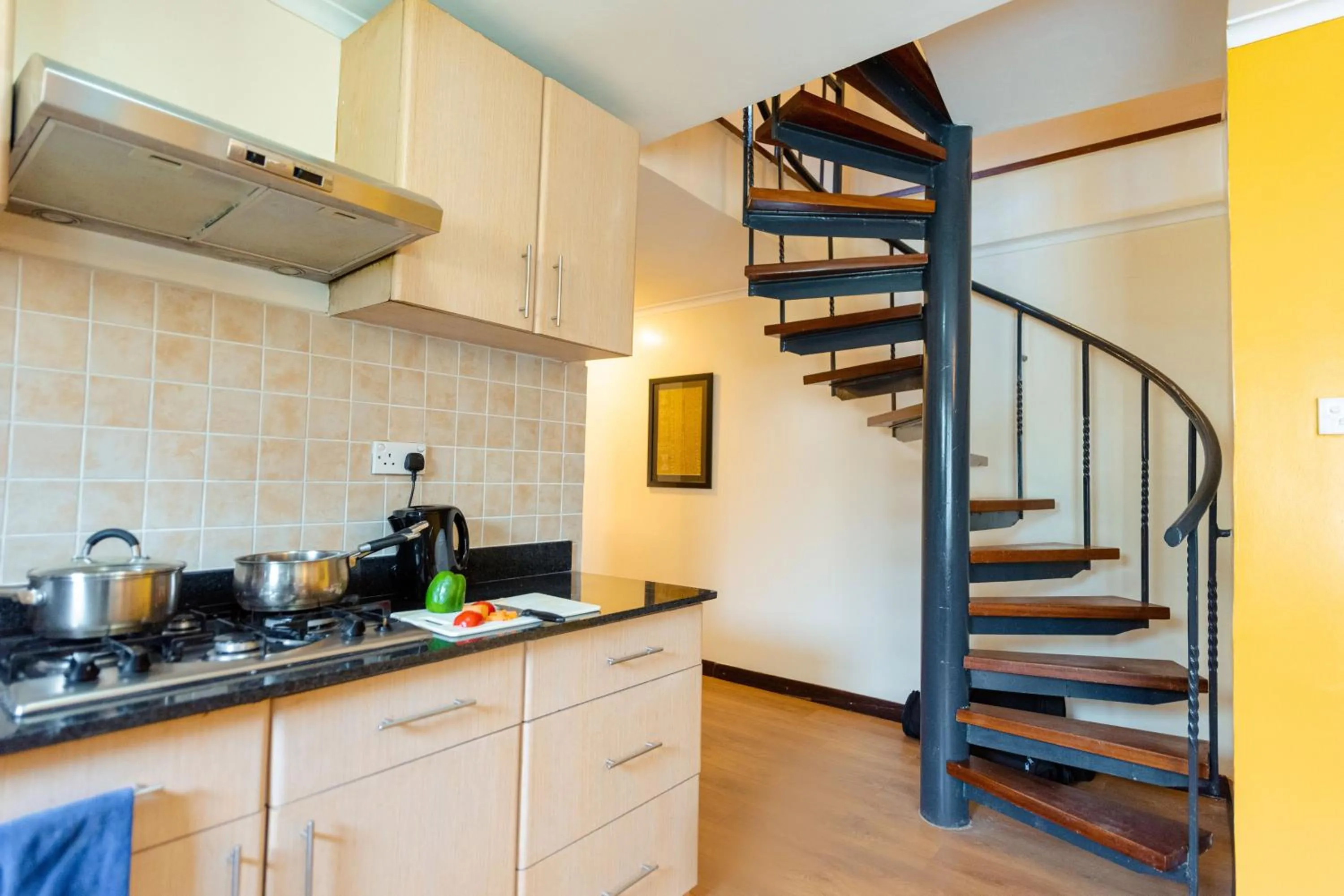 Kitchen or kitchenette in Heri Heights Hotel Apartments, SureStay Collection by Best Western