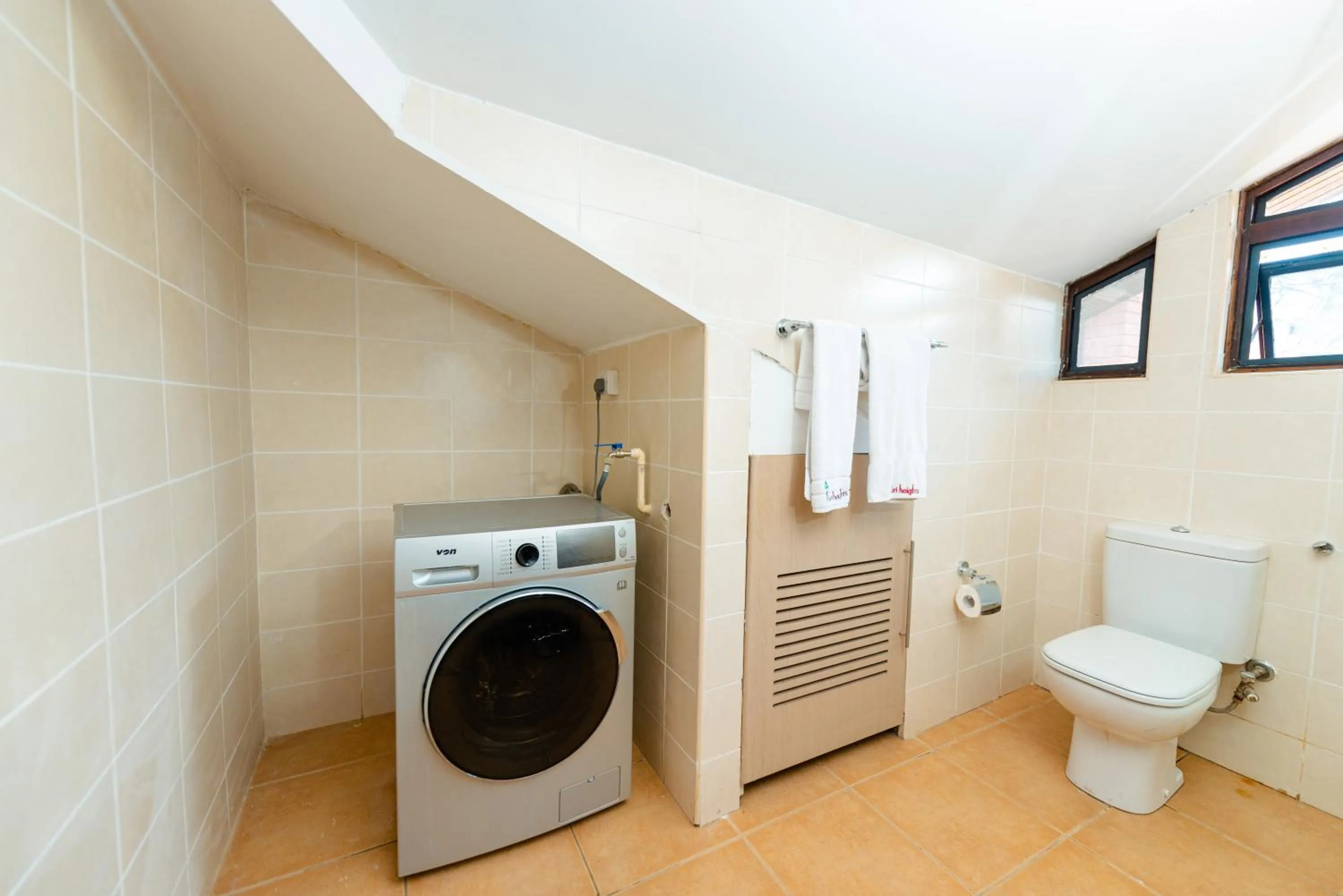 Toilet in Heri Heights Hotel Apartments, SureStay Collection by Best Western
