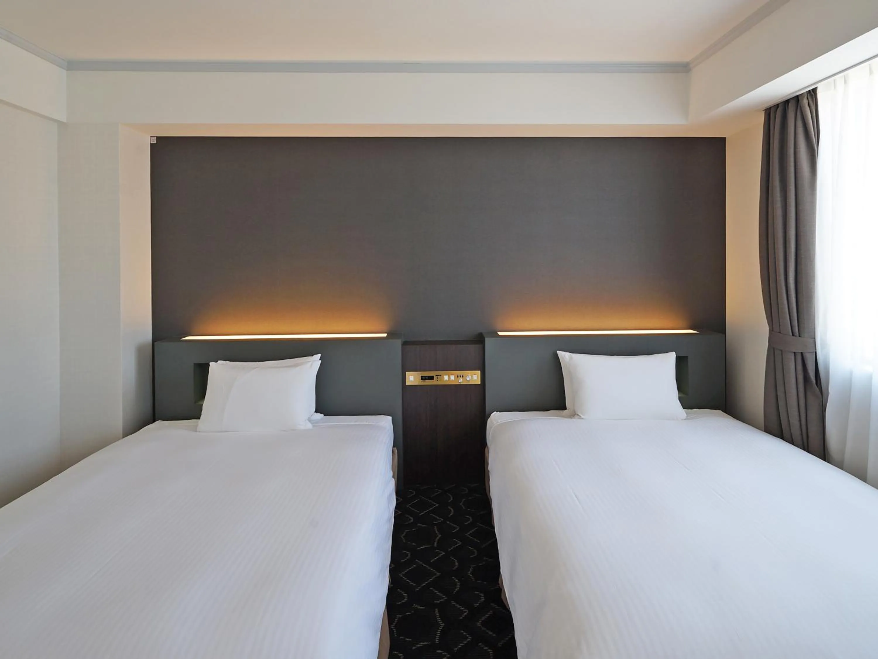 Bed in Chisun Grand Takayama