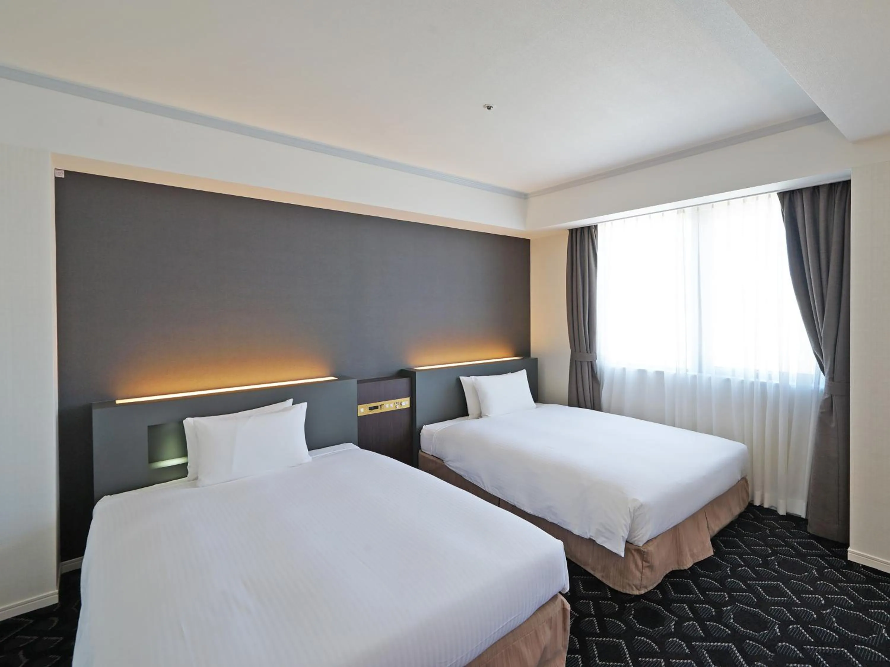 Bed in Chisun Grand Takayama