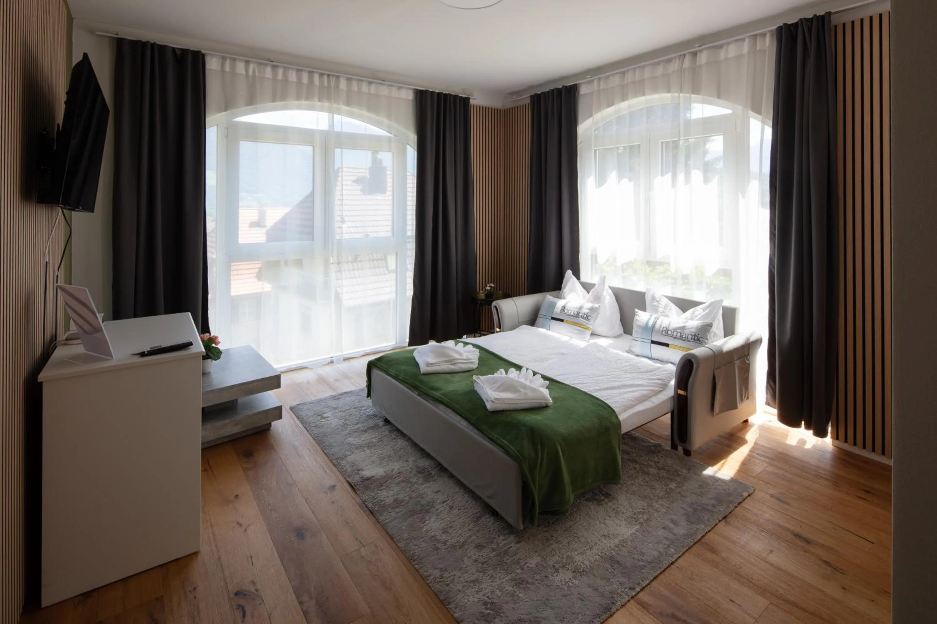 Bed in BERG & BERG APARTMENTS - Spiez Self-Check-in