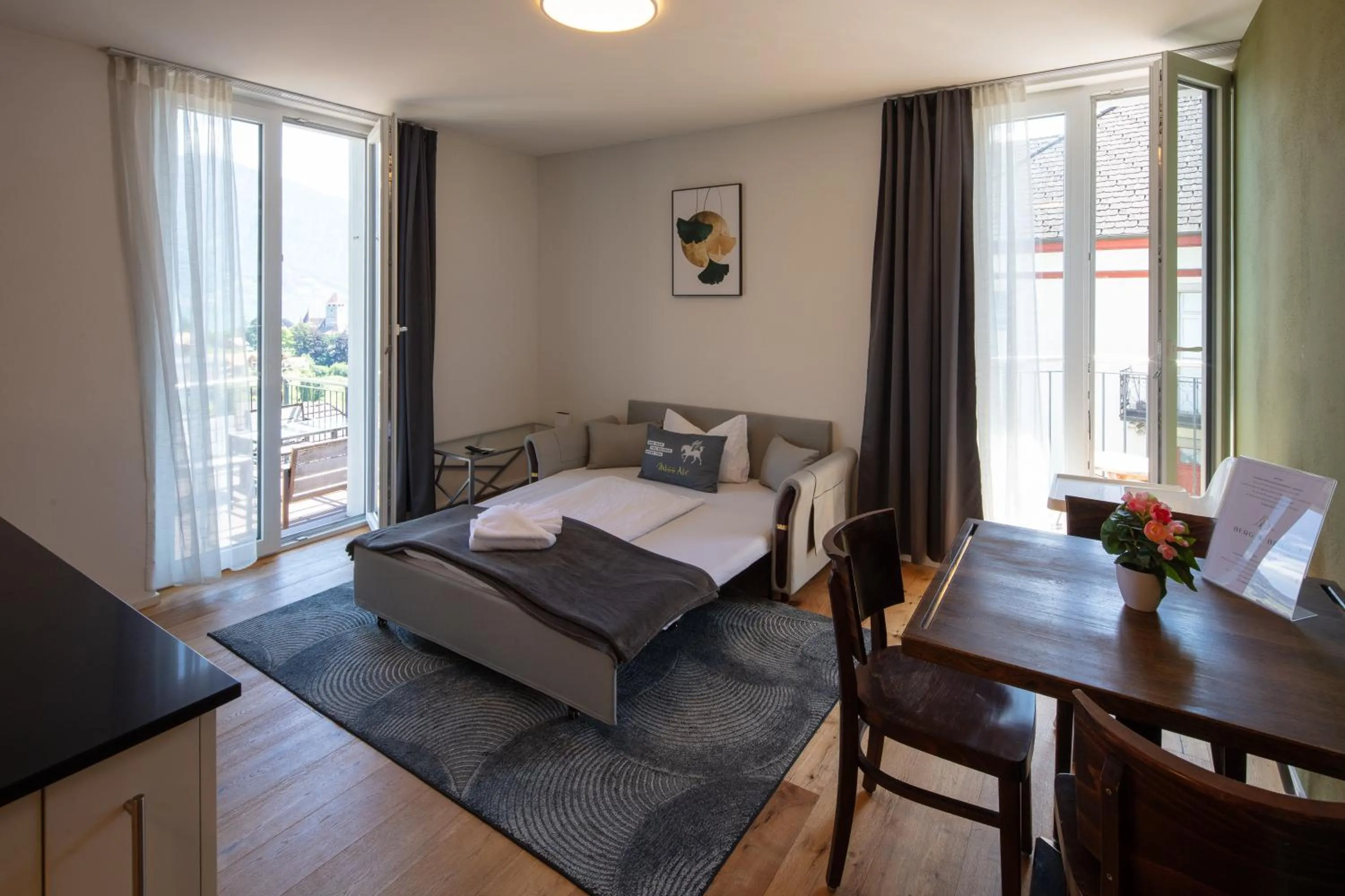 Bed in BERG & BERG APARTMENTS - Spiez Self-Check-in