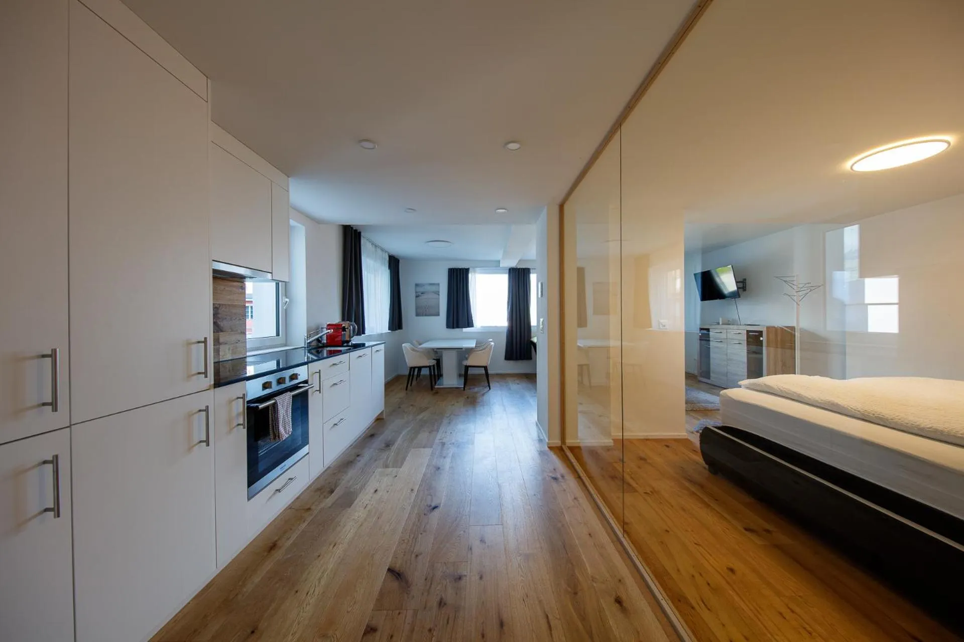 Bed in BERG & BERG APARTMENTS - Spiez Self-Check-in