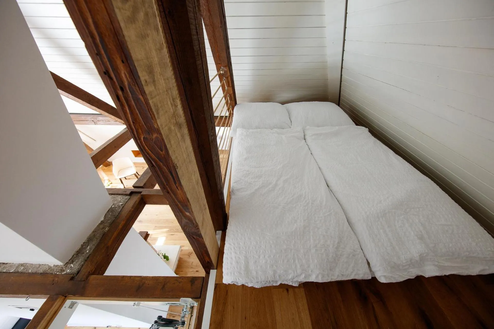 Bed in BERG & BERG APARTMENTS - Spiez Self-Check-in