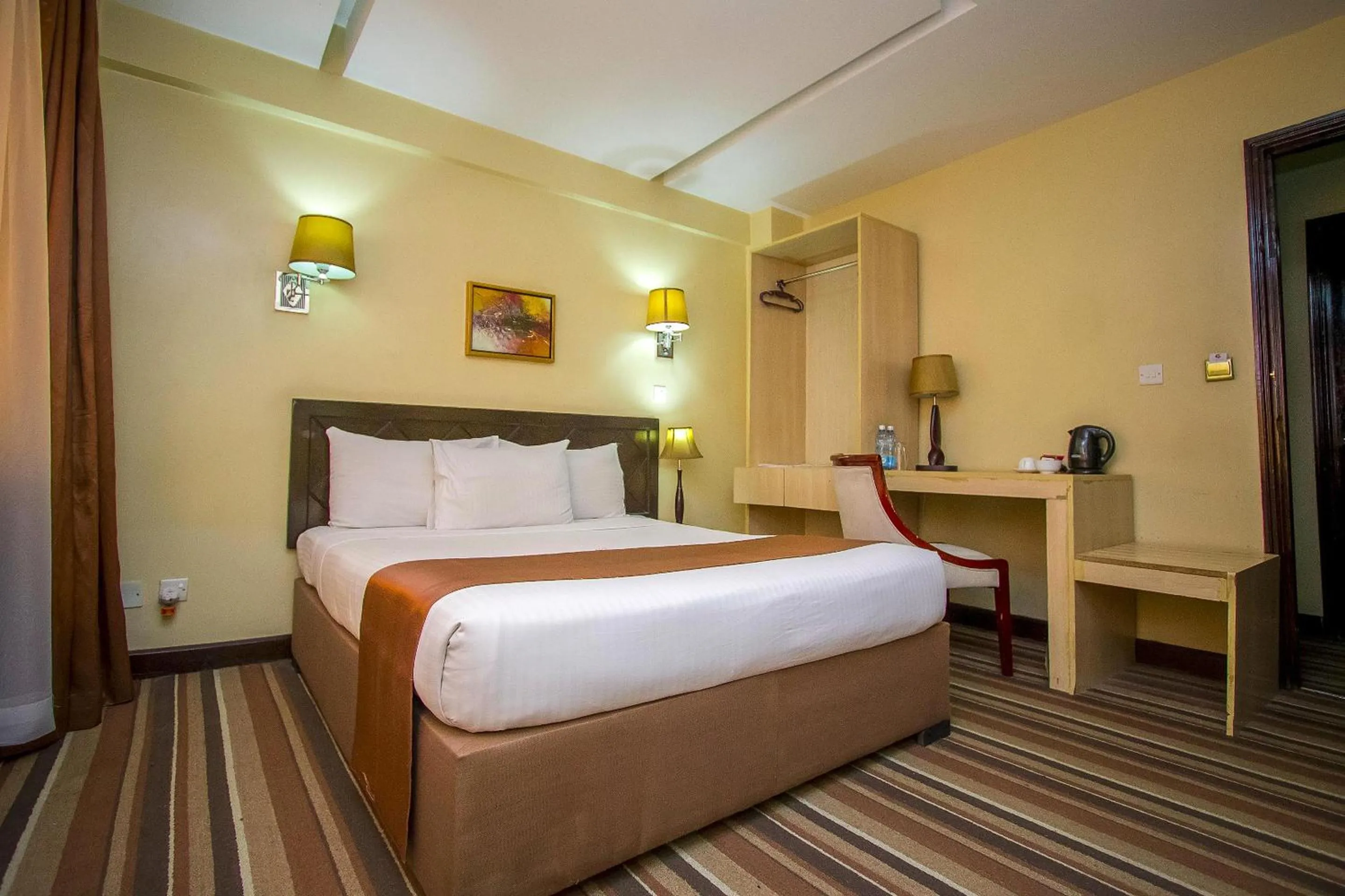 Bed in The Clarion Hotel