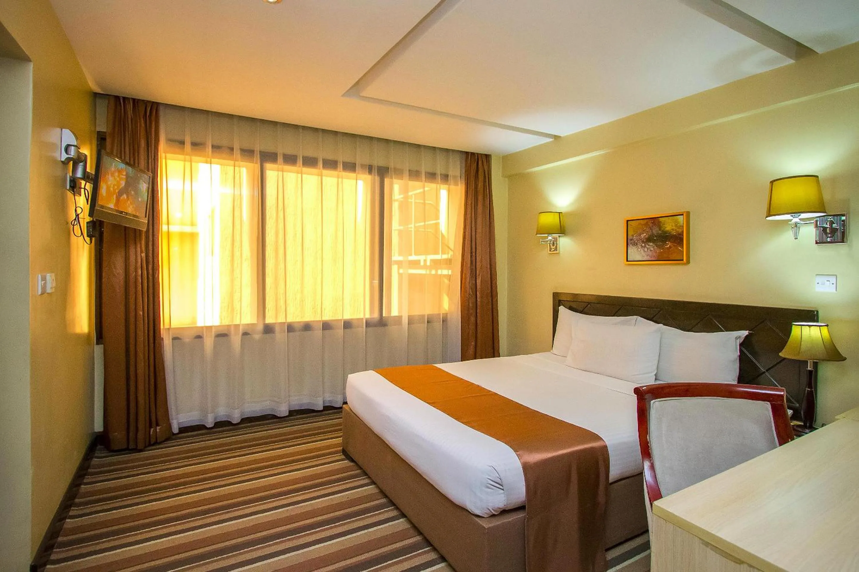 Bed in The Clarion Hotel