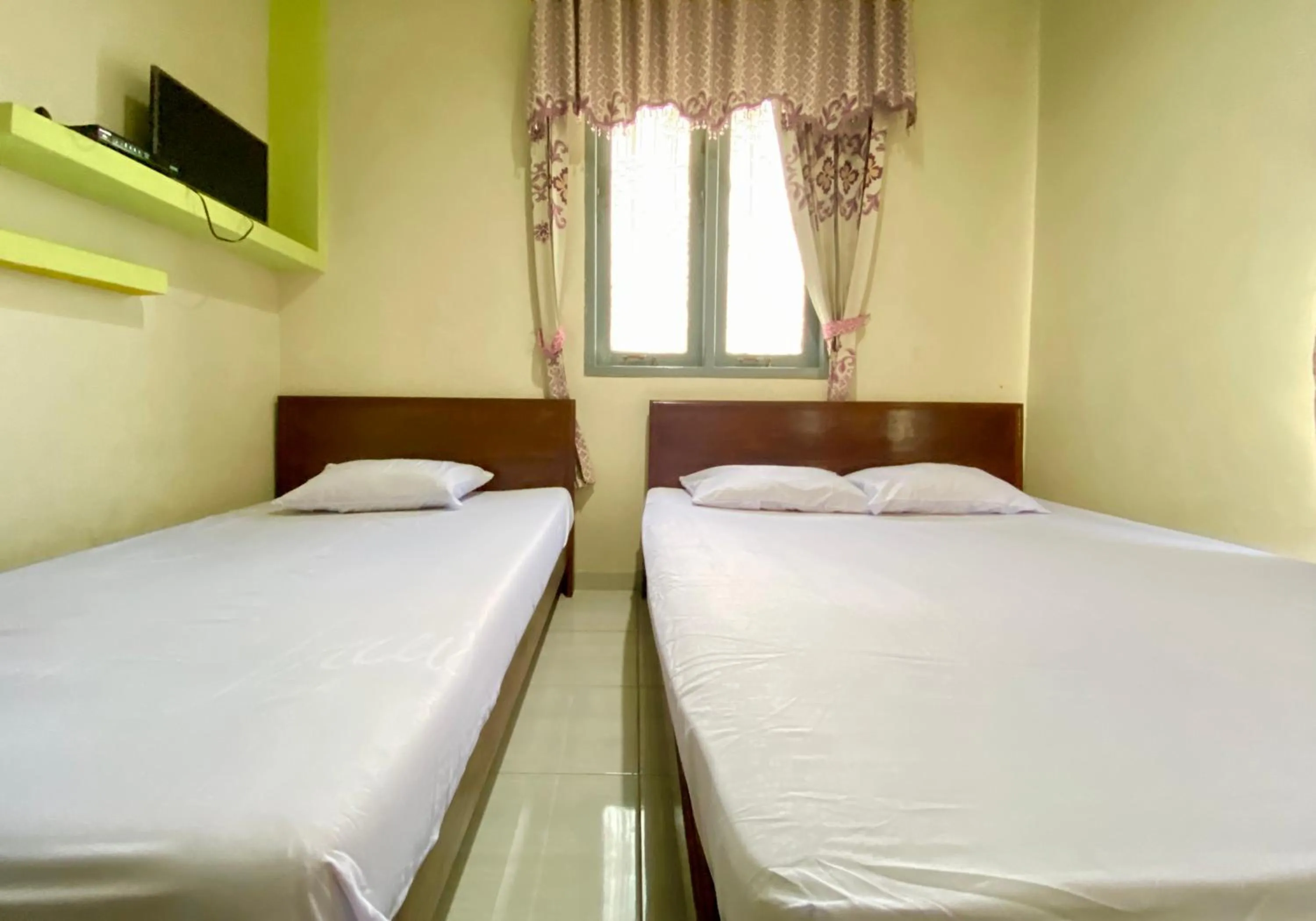 Bed in Homestay Srikandi Syariah Dieng RedPartner