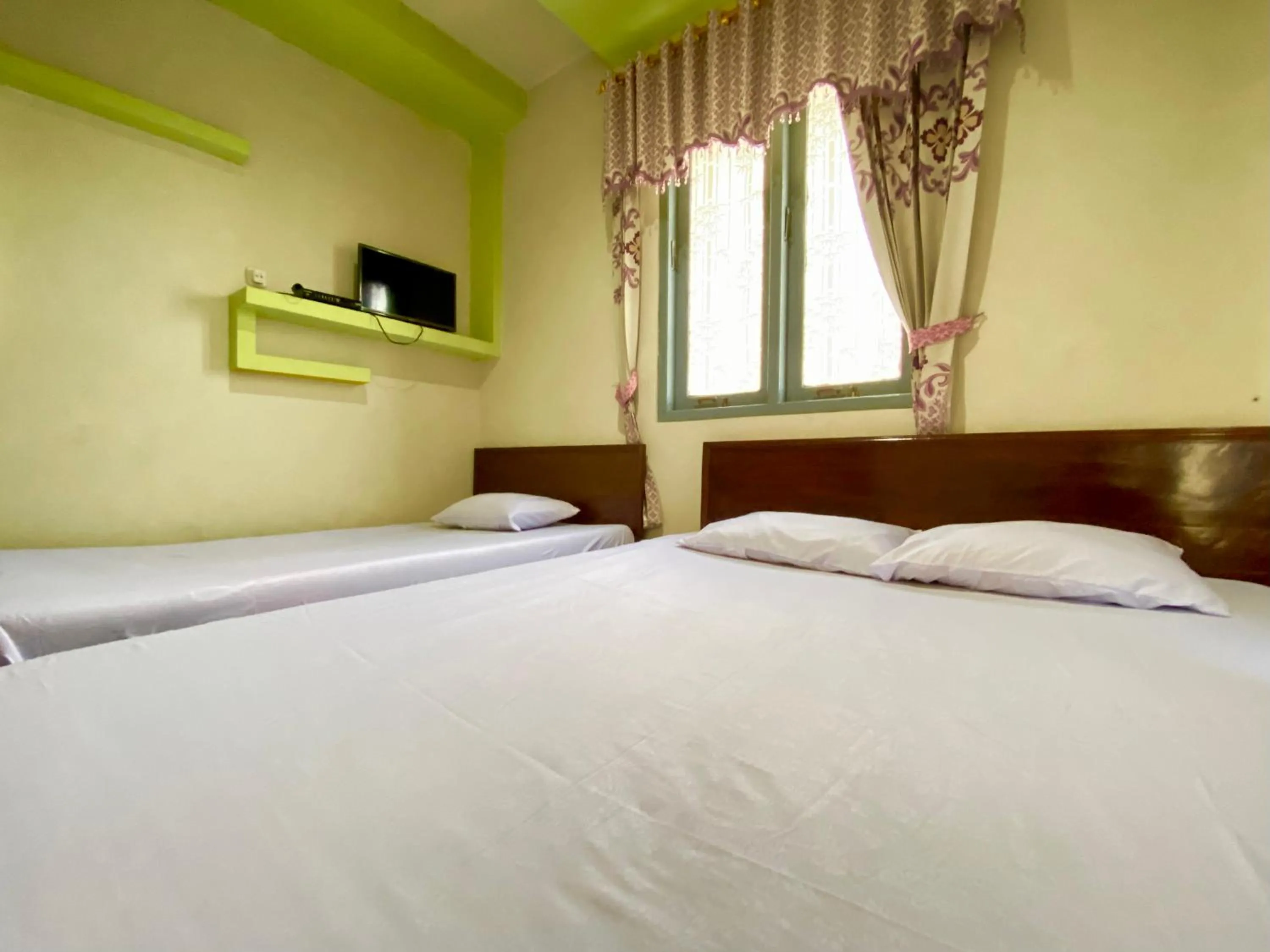 Bed in Homestay Srikandi Syariah Dieng RedPartner