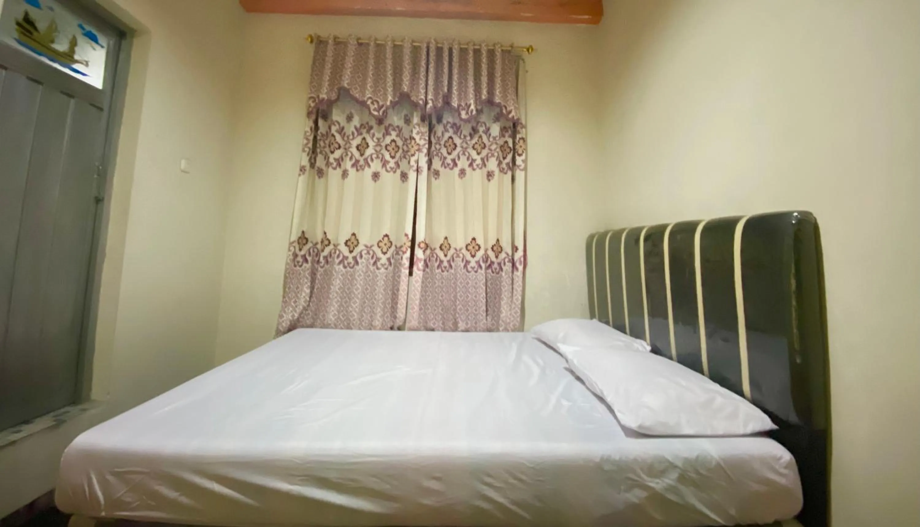 Bed in Homestay Srikandi Syariah Dieng RedPartner