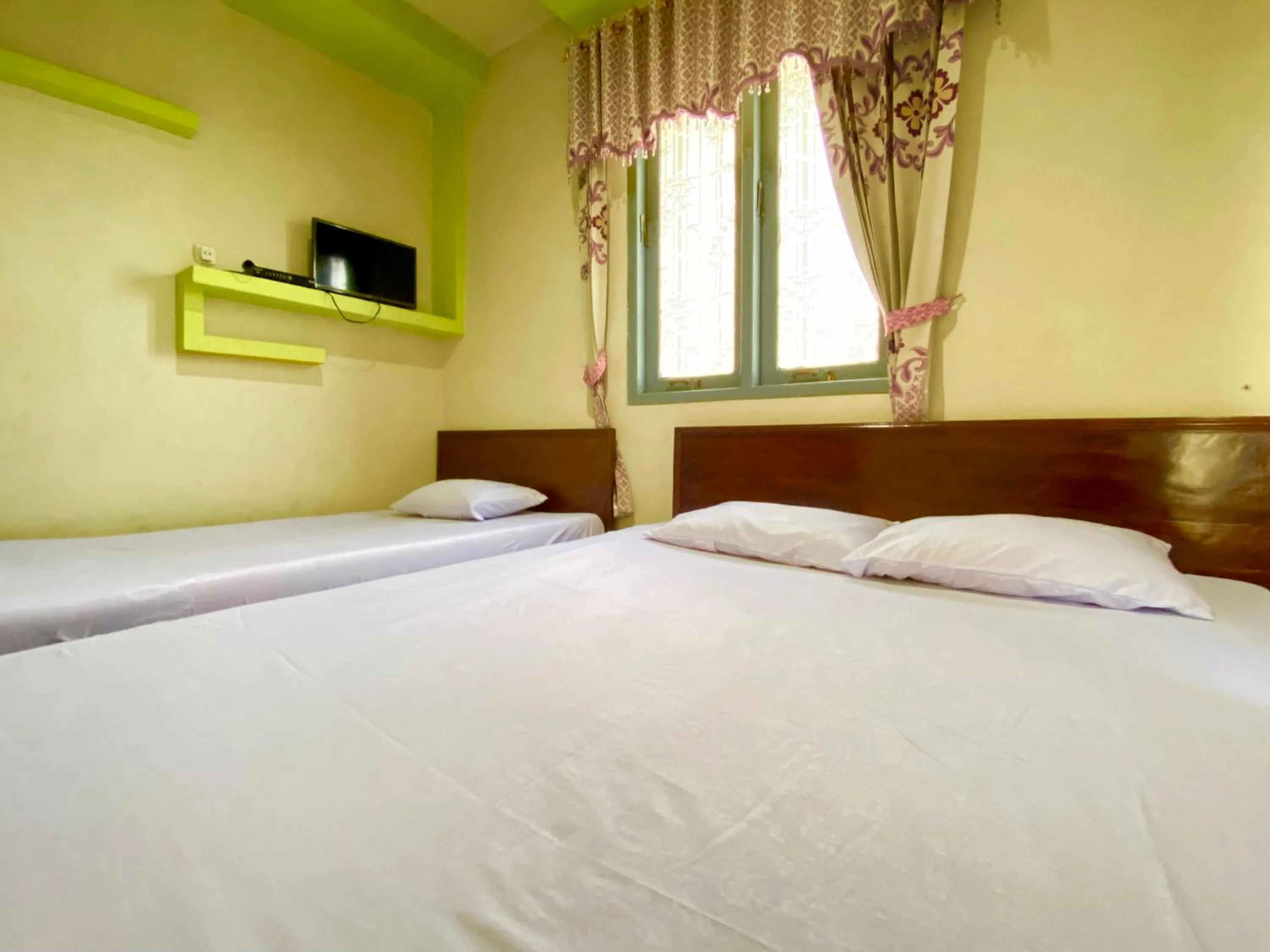Bed in Homestay Srikandi Syariah Dieng RedPartner