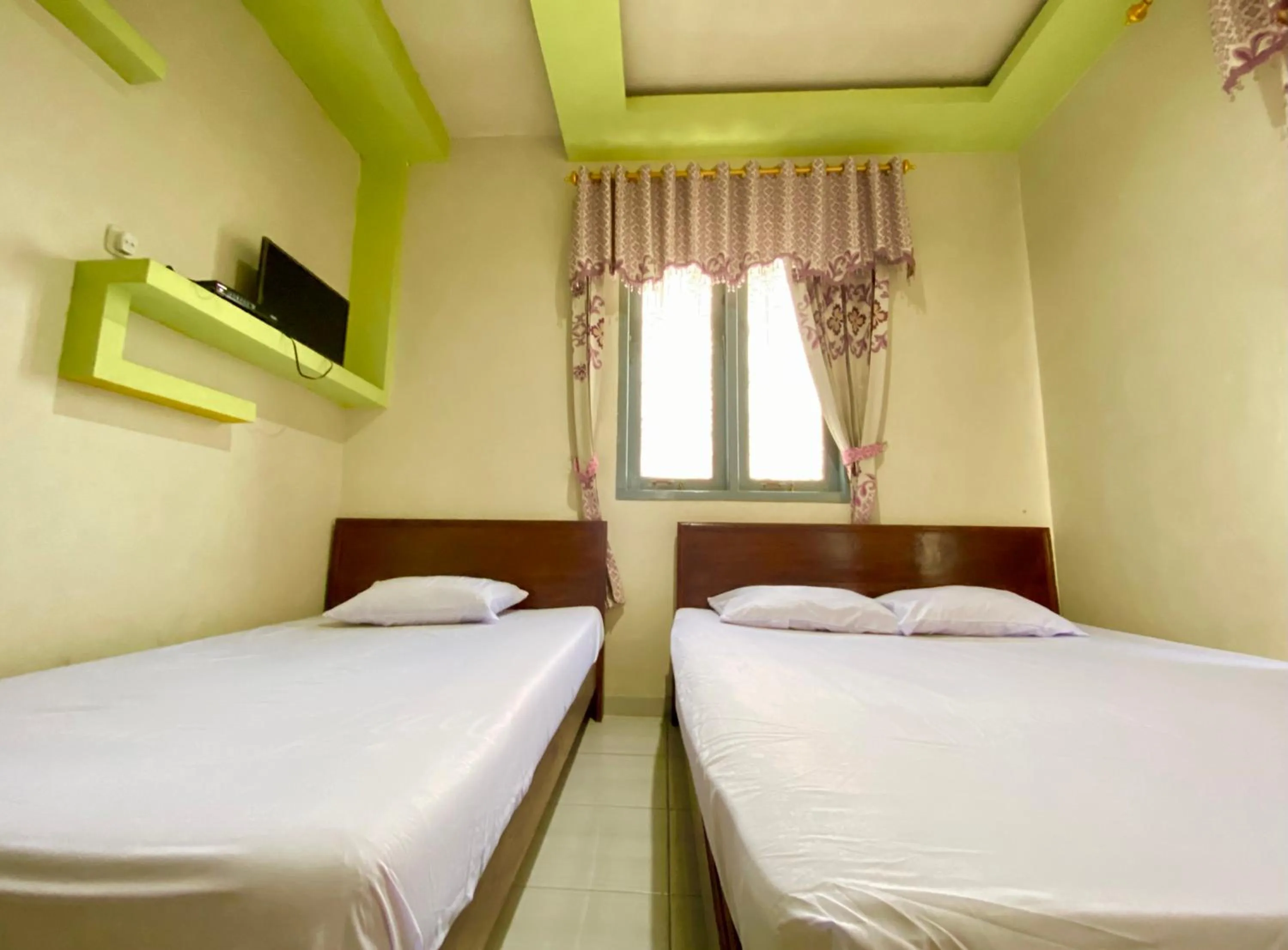 Bed in Homestay Srikandi Syariah Dieng RedPartner