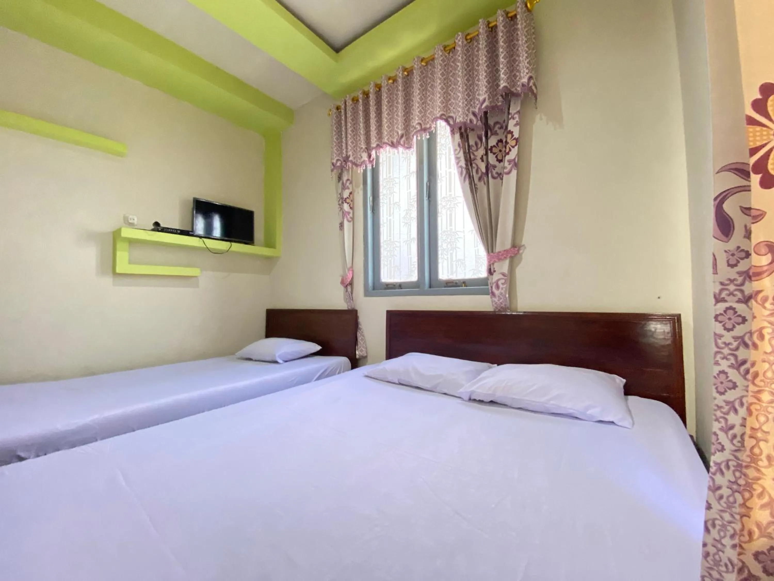 Bed in Homestay Srikandi Syariah Dieng RedPartner