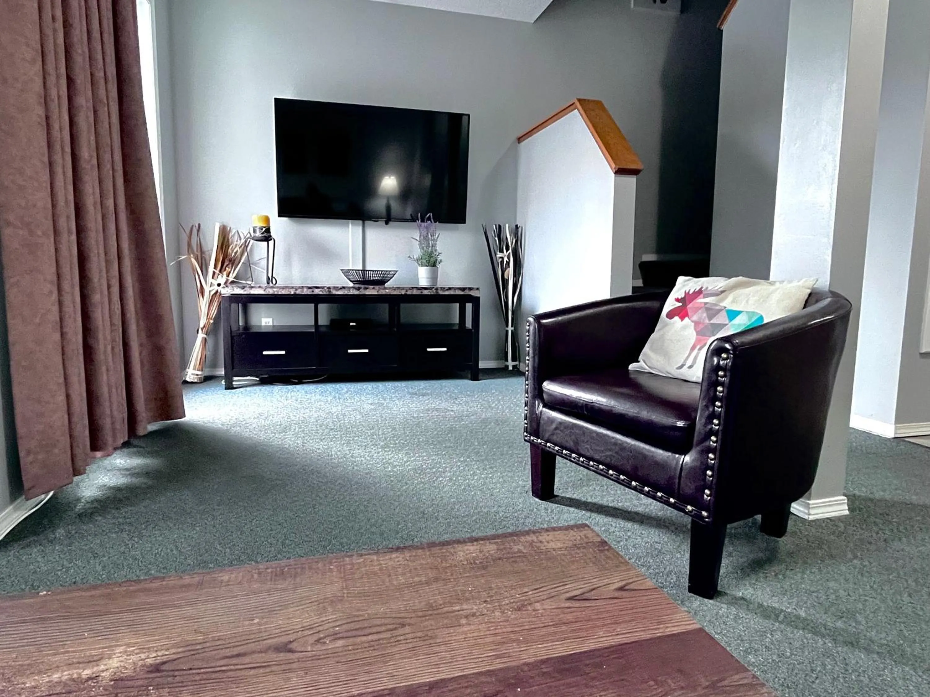 TV and multimedia in Canadian Rockies Chalets by Trilink - 2 & 3 Bedroom Condos - Self Check-In - Walking Distance to Downtown - Free Parking - Pet-Friendly - No AC