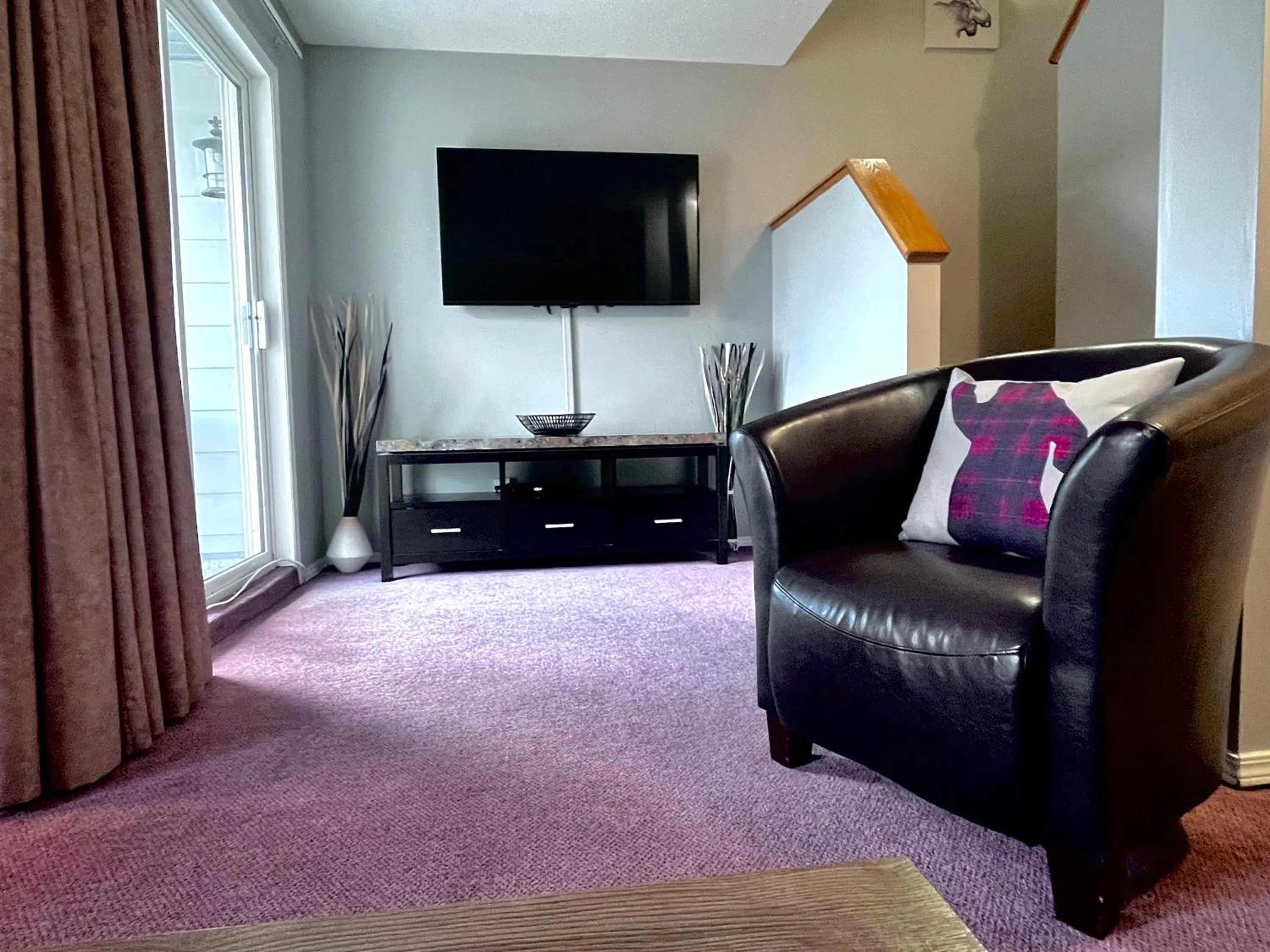 TV and multimedia in Canadian Rockies Chalets by Trilink - 2 & 3 Bedroom Condos - Self Check-In - Walking Distance to Downtown - Free Parking - Pet-Friendly - No AC