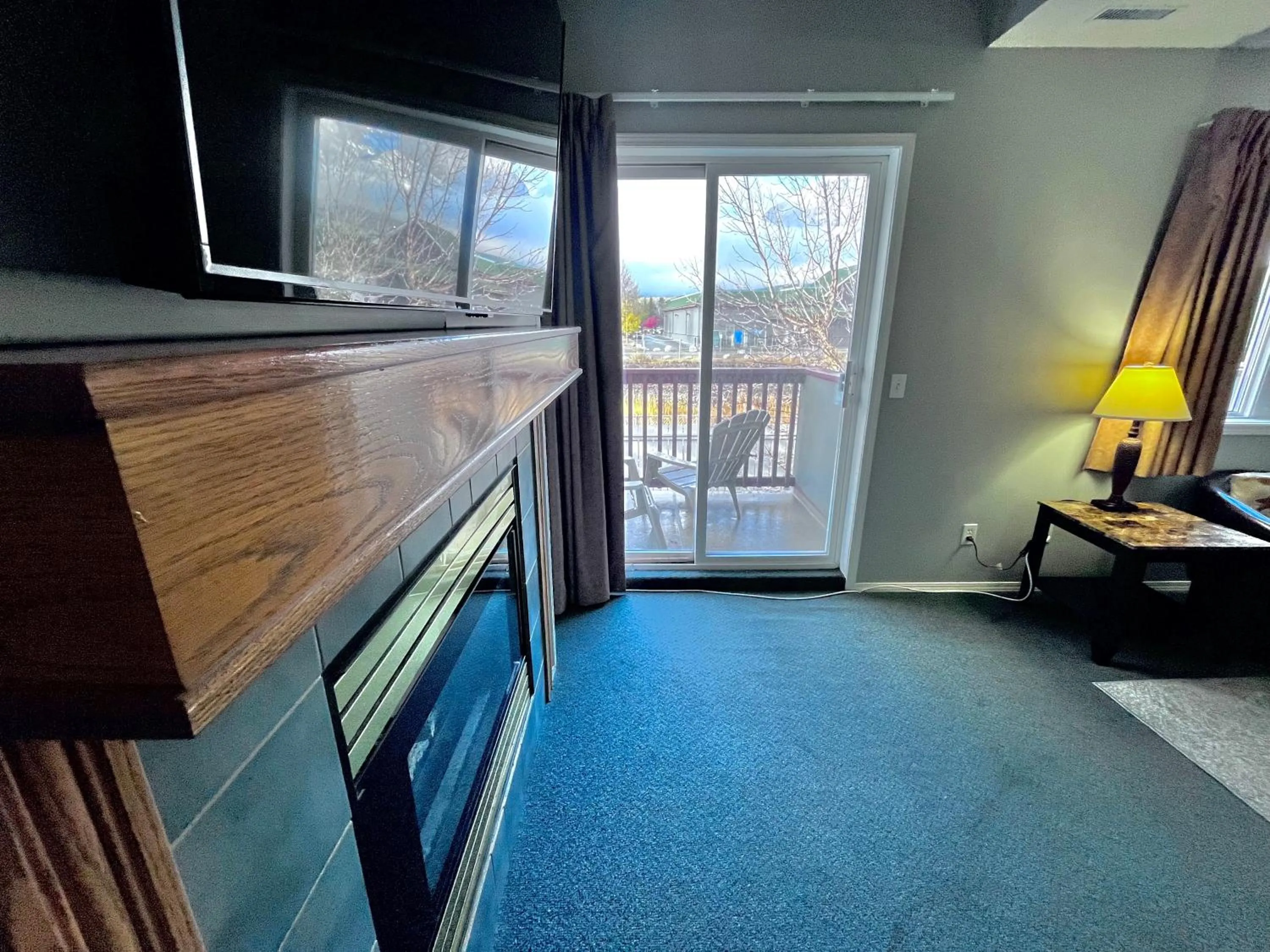 TV and multimedia in Canadian Rockies Chalets by Trilink - 2 & 3 Bedroom Condos - Self Check-In - Walking Distance to Downtown - Free Parking - Pet-Friendly - No AC