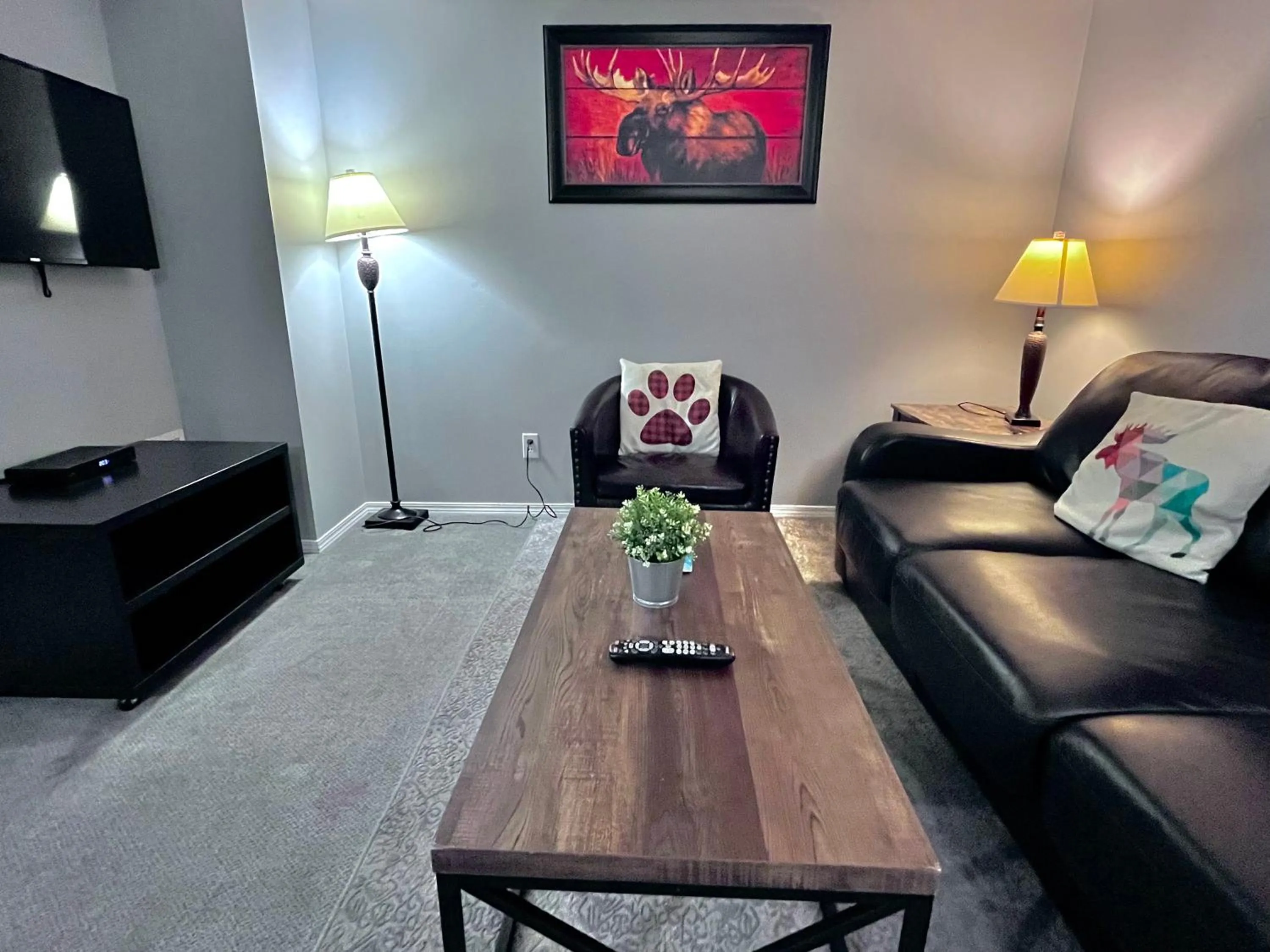 TV and multimedia in Canadian Rockies Chalets by Trilink - 2 & 3 Bedroom Condos - Self Check-In - Walking Distance to Downtown - Free Parking - Pet-Friendly - No AC