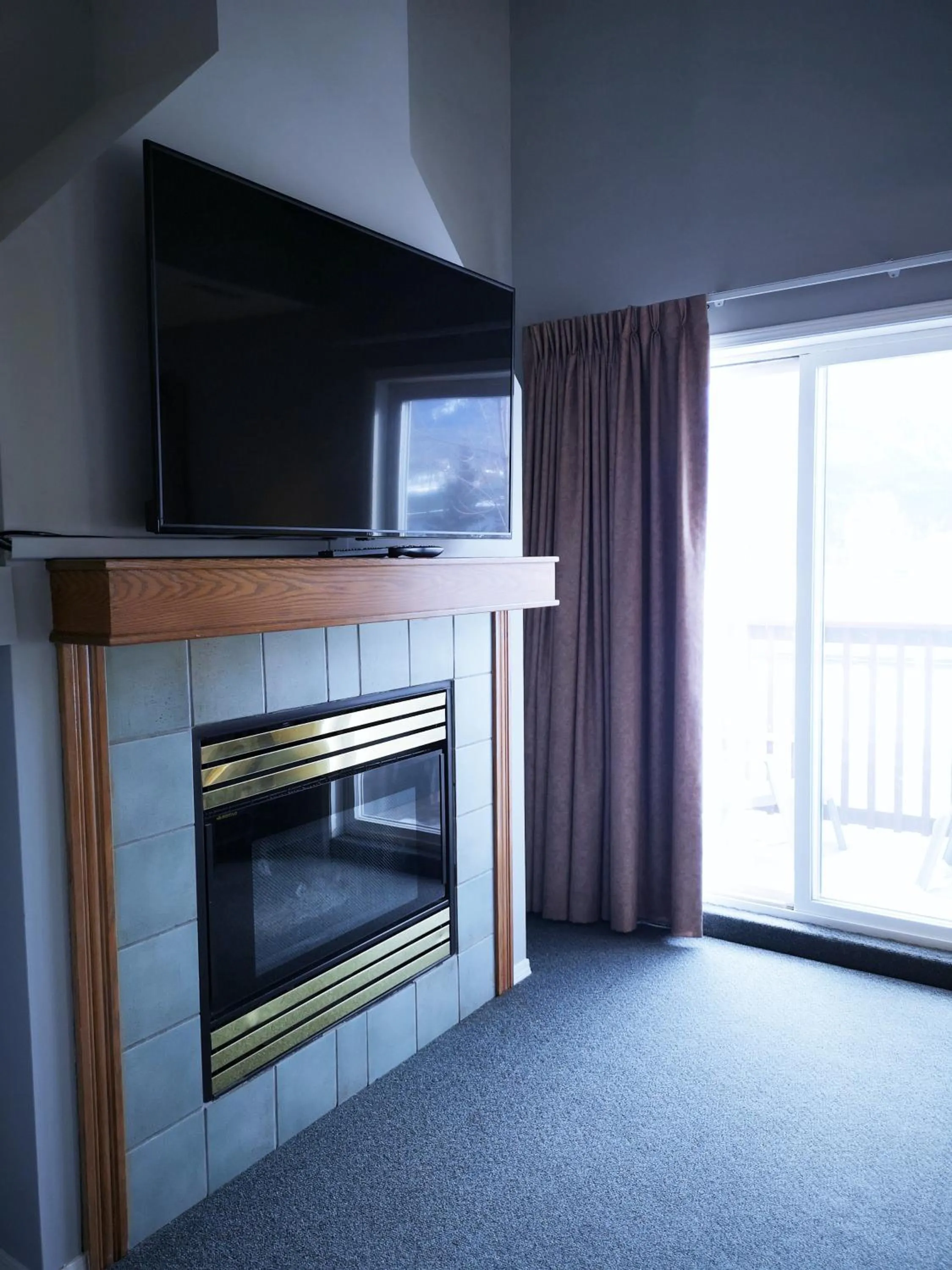 TV and multimedia in Canadian Rockies Chalets by Trilink - 2 & 3 Bedroom Condos - Self Check-In - Walking Distance to Downtown - Free Parking - Pet-Friendly - No AC