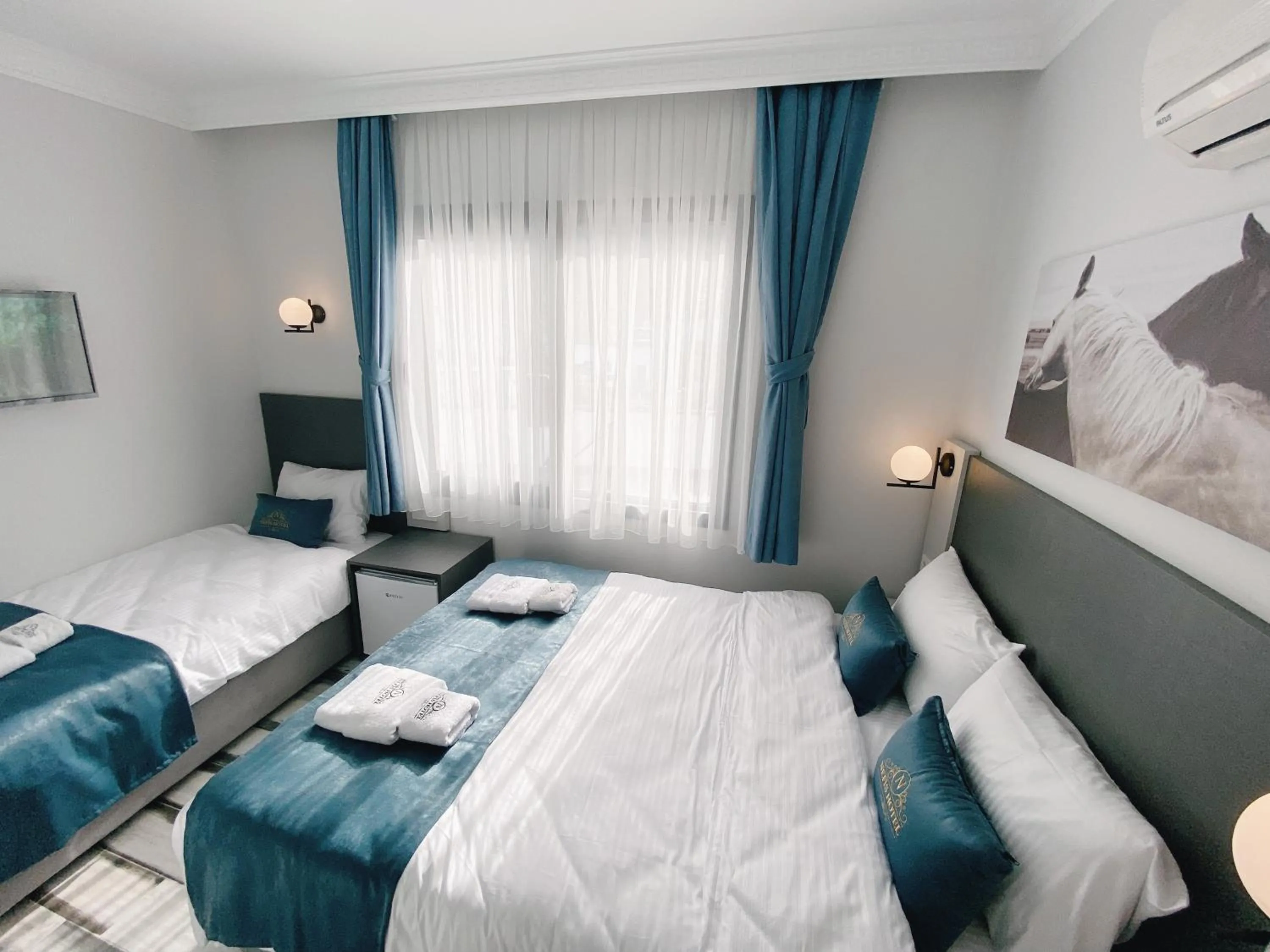 Bed in Nefis Hotel City