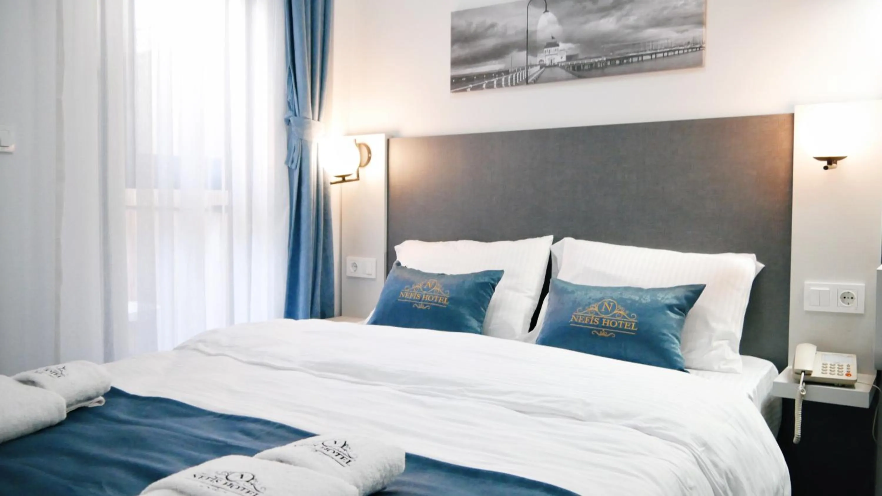 Bed in Nefis Hotel City