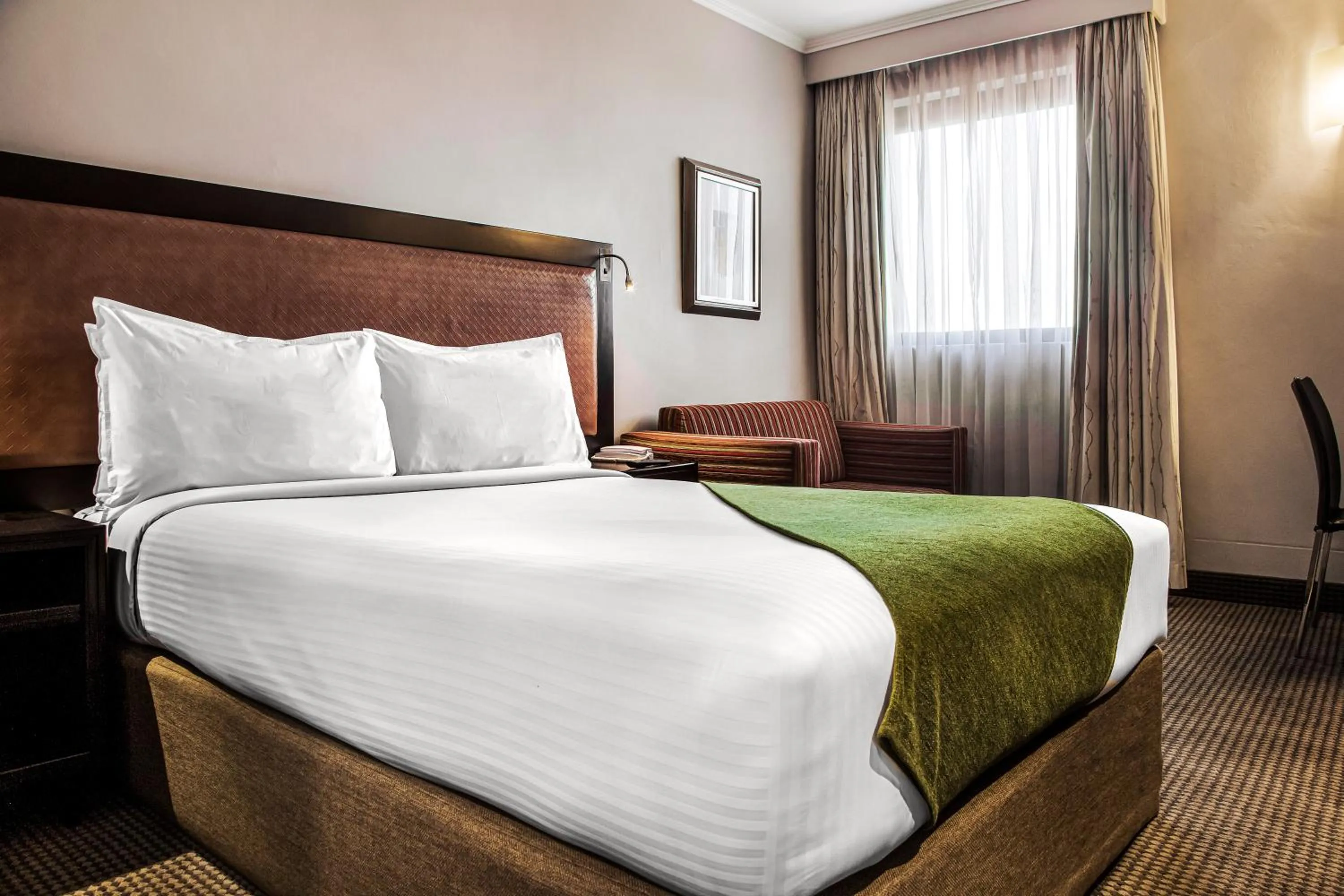 Bed in The RidgePoint Hotel