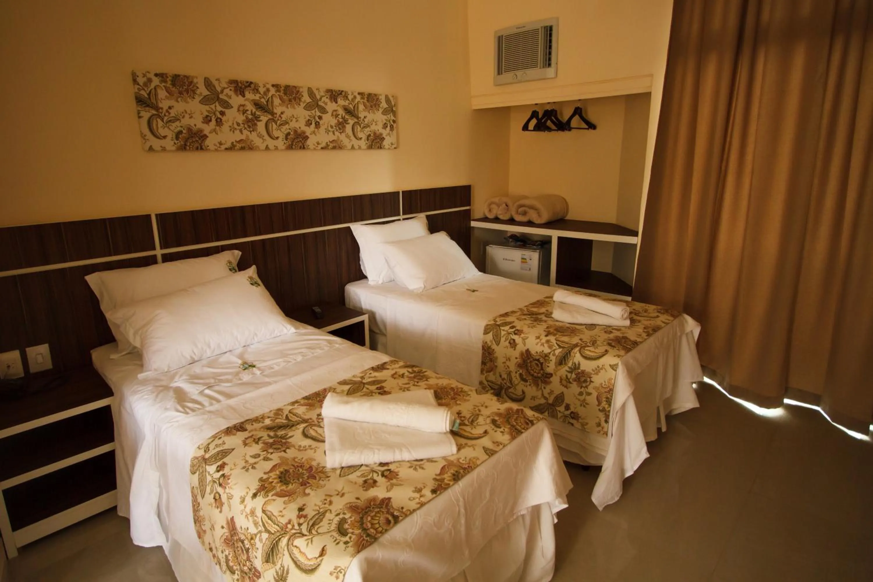 Bed in Estrada Real Palace Hotel