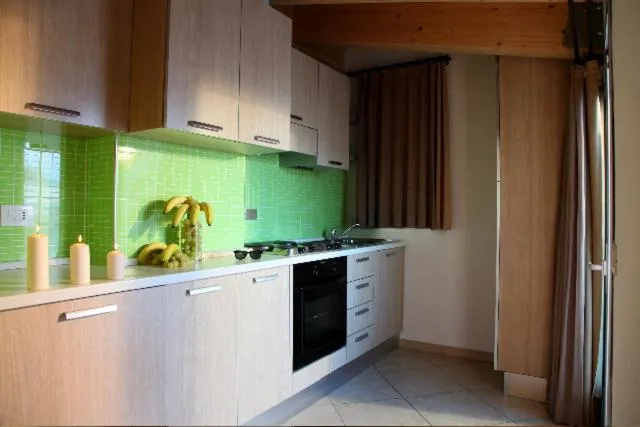 Kitchen or kitchenette in Residence Ilario Suite Hotel
