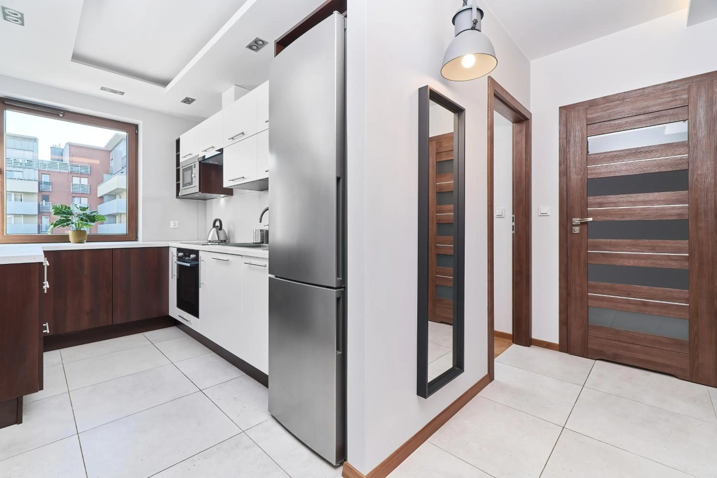 Kitchen or kitchenette in Nowa Tęczowa Apartments Promenada Staromiejska by Noclegi Renters