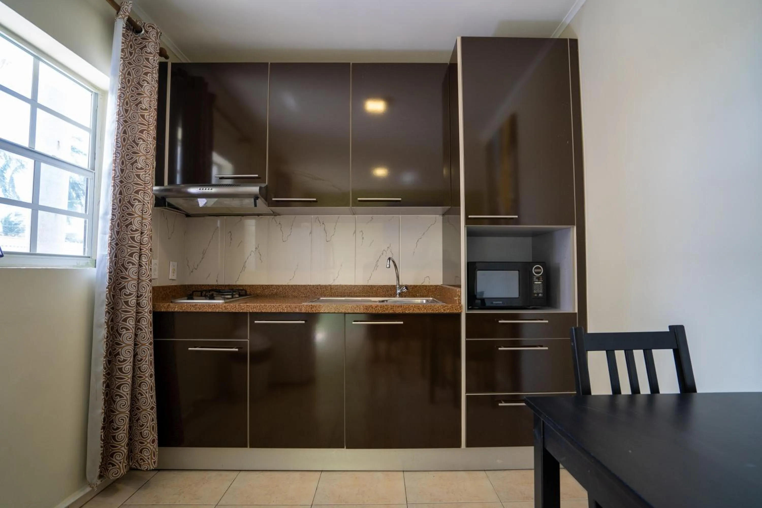 Kitchen or kitchenette in Delynne Boutique Hotel