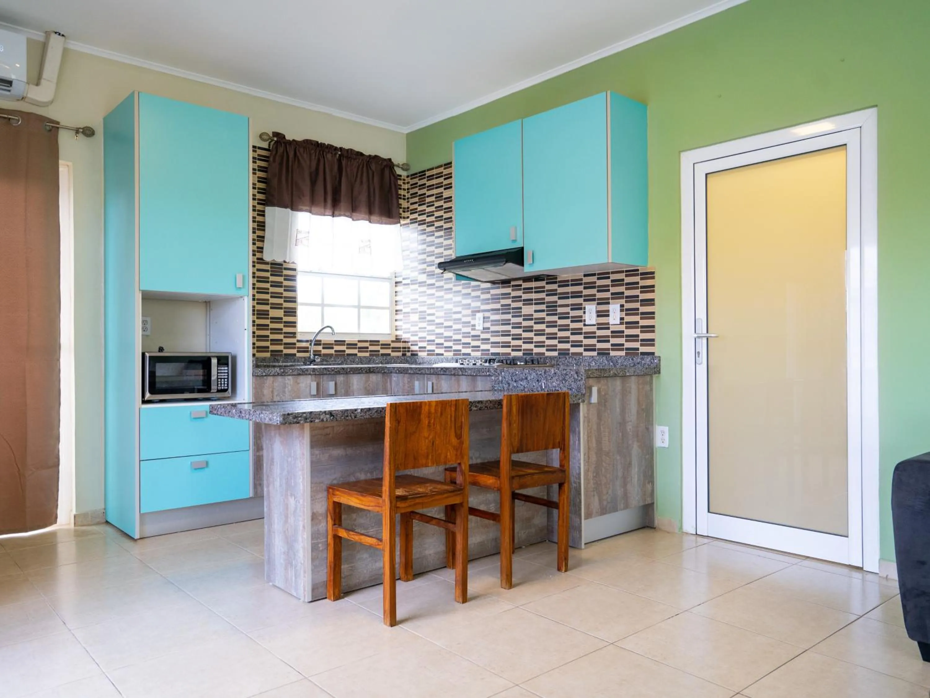 Kitchen or kitchenette in Delynne Boutique Hotel