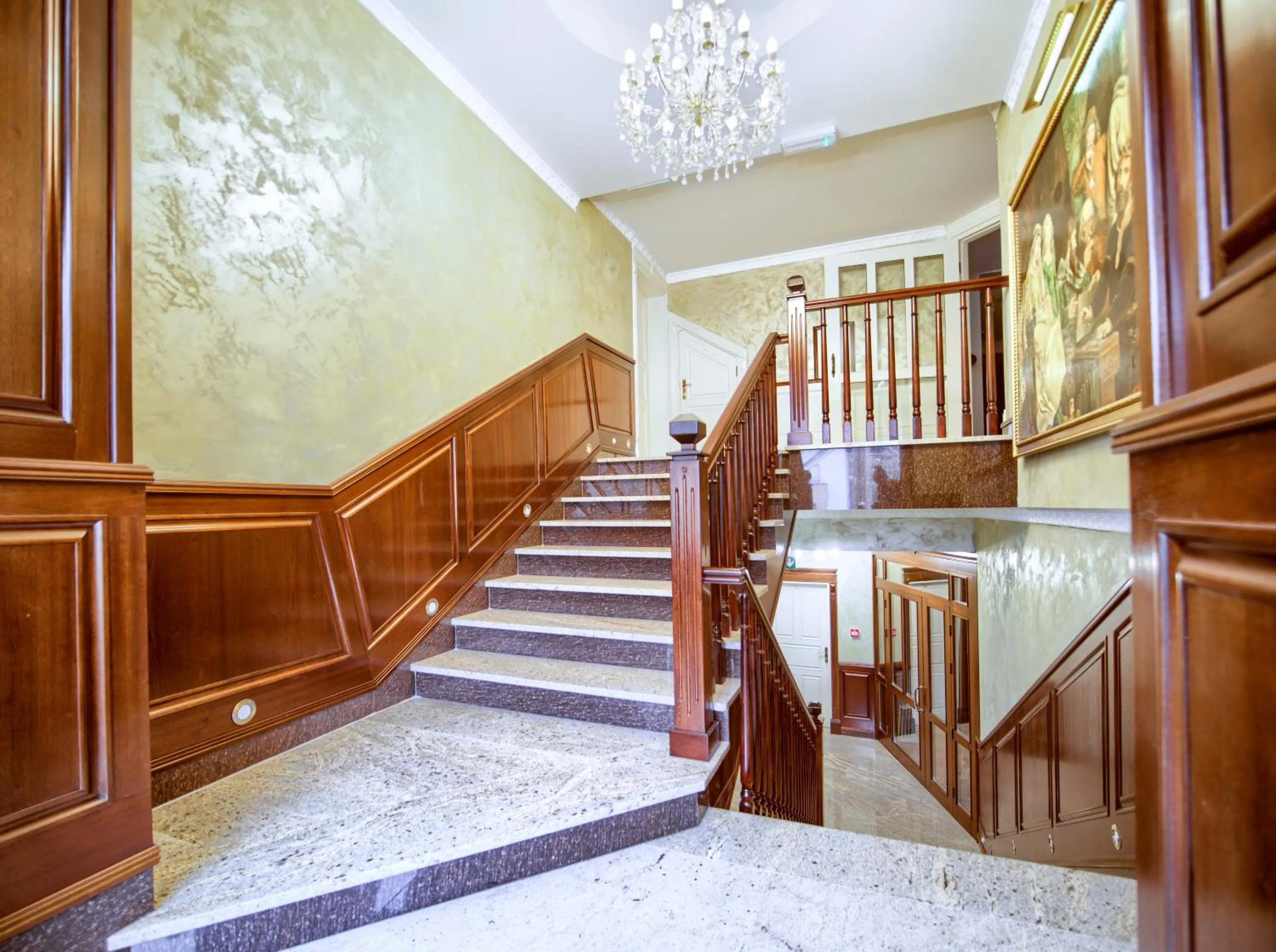 Communal lounge/ TV room in ApartHotel Hubertus