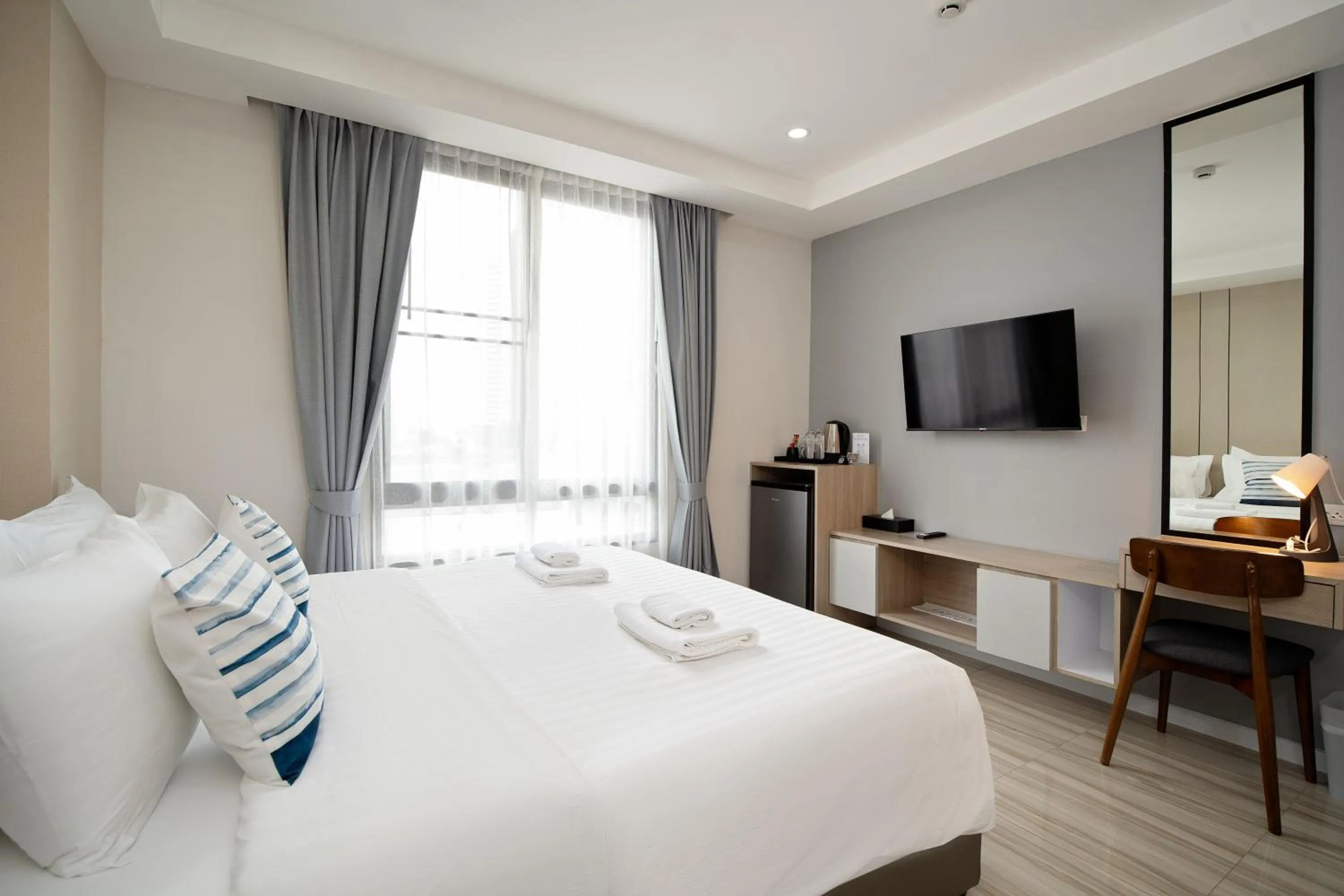 Bed in The Riski Hotel at Bangphlat Station SHA