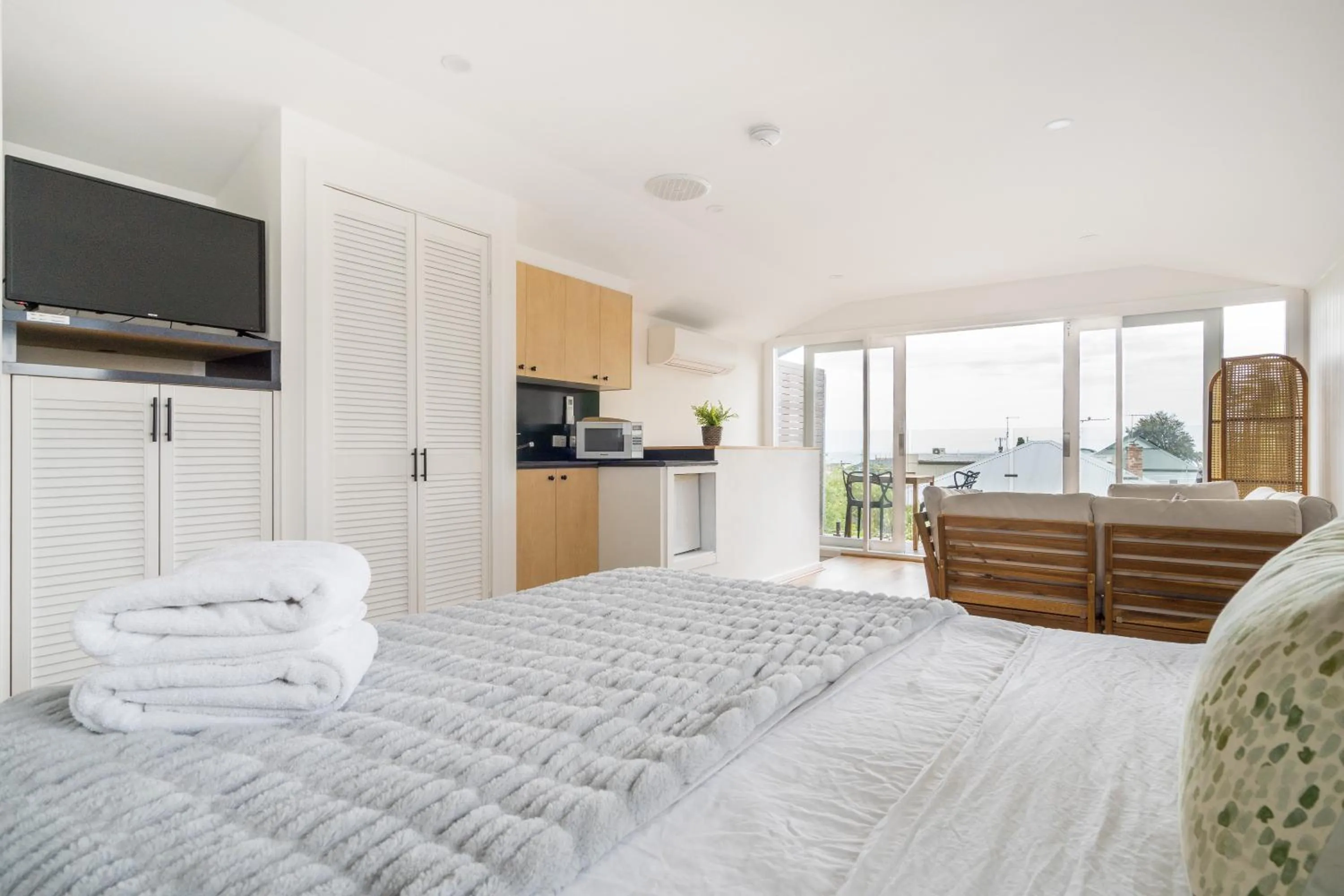 Photo of the whole room, Bed in By The Seaside