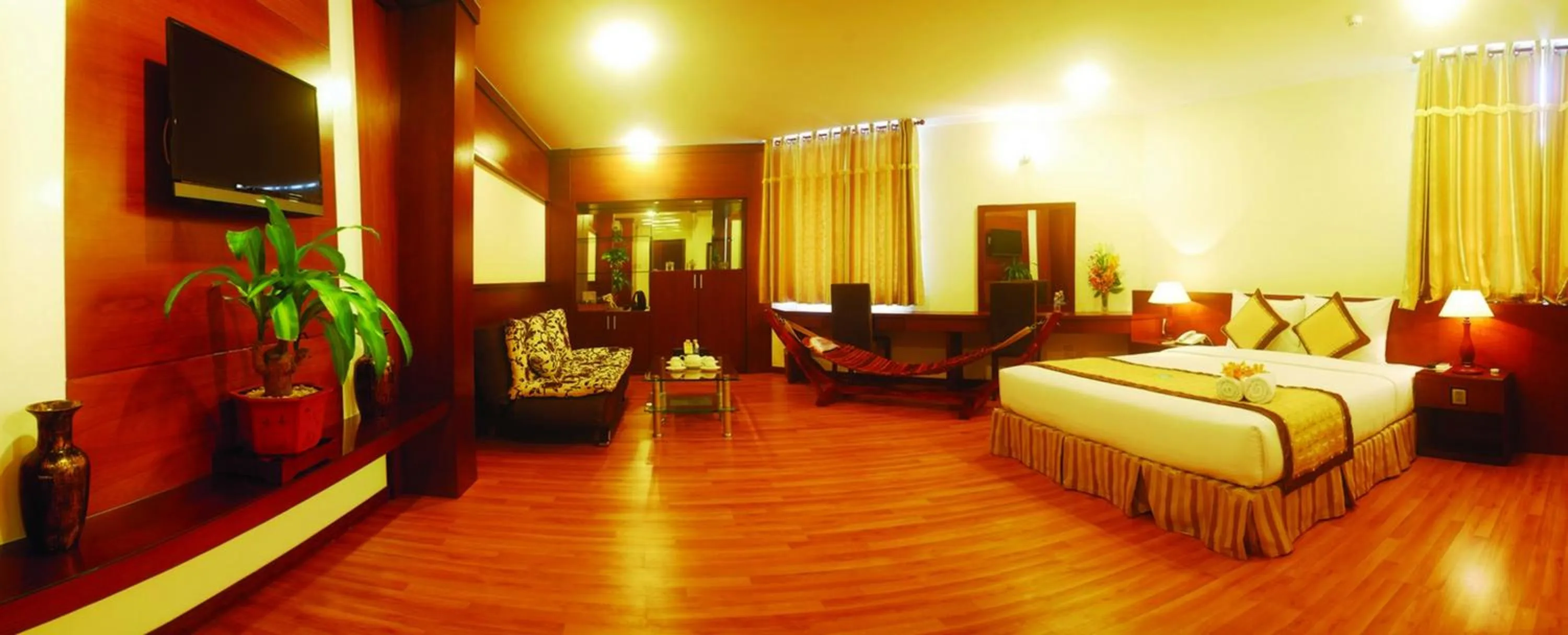 Living room, Bed in Hau Giang Hotel