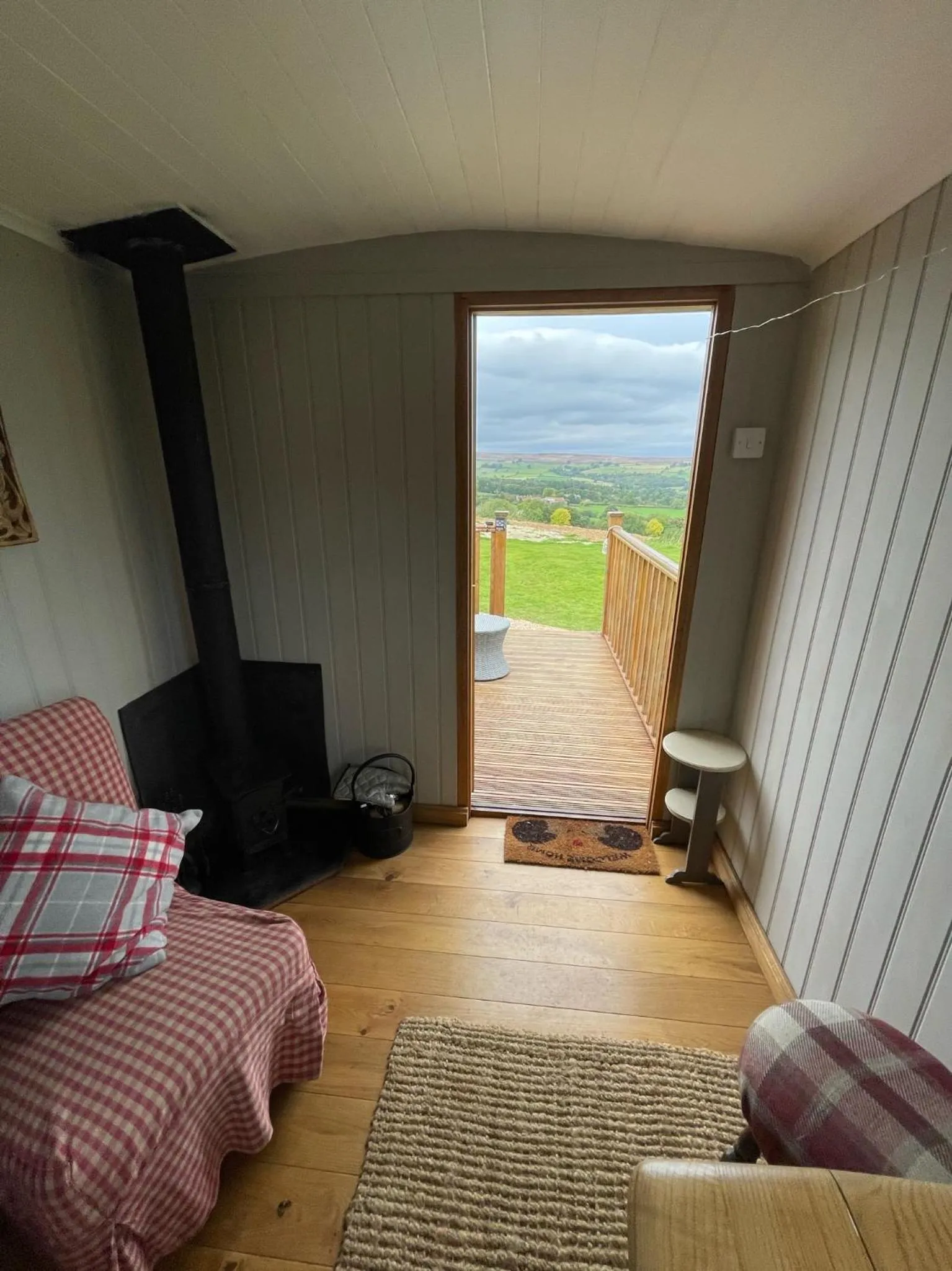 Bed in Oakley View Shepherds Hut with hot tub